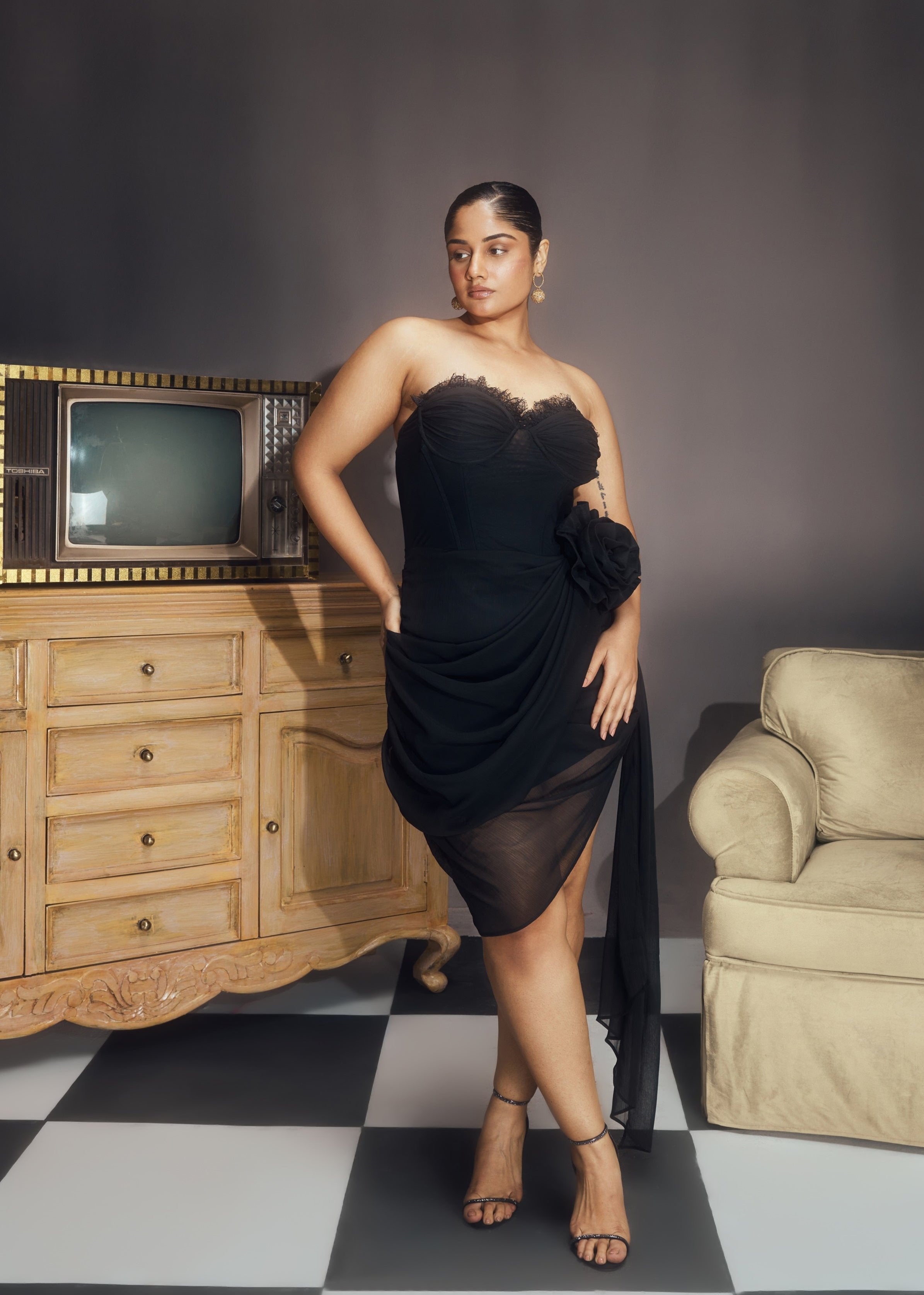 Abba Black Chiffon Strapless Rose Embellished Asymmetrical Midi Bustier Dress, featuring delicate rose details and a stylish asymmetrical hemline.