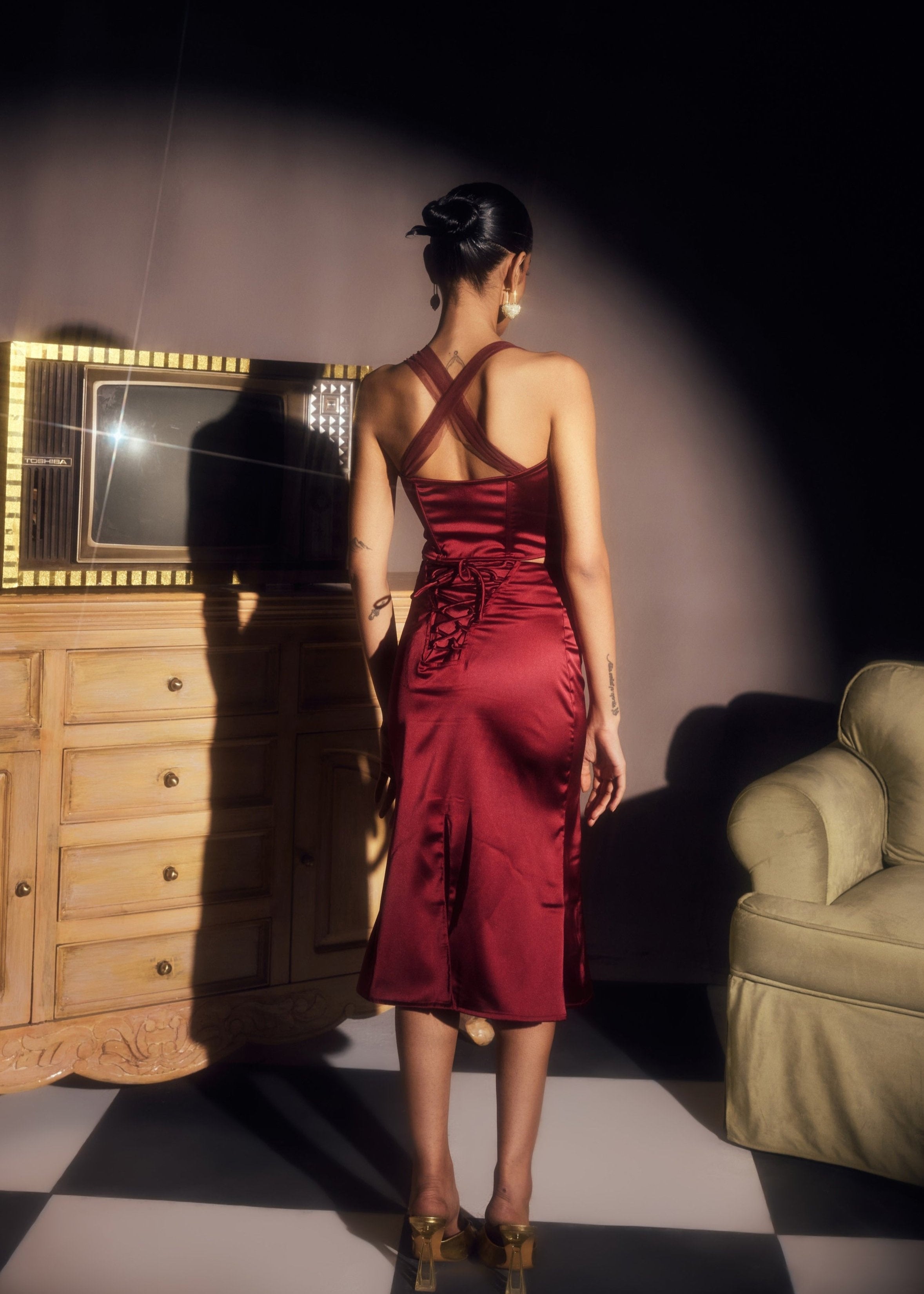 Alina Burgundy Stretch Satin Corset and Midi Skirt Set, offering a sleek satin finish with a chic corset and midi skirt combination