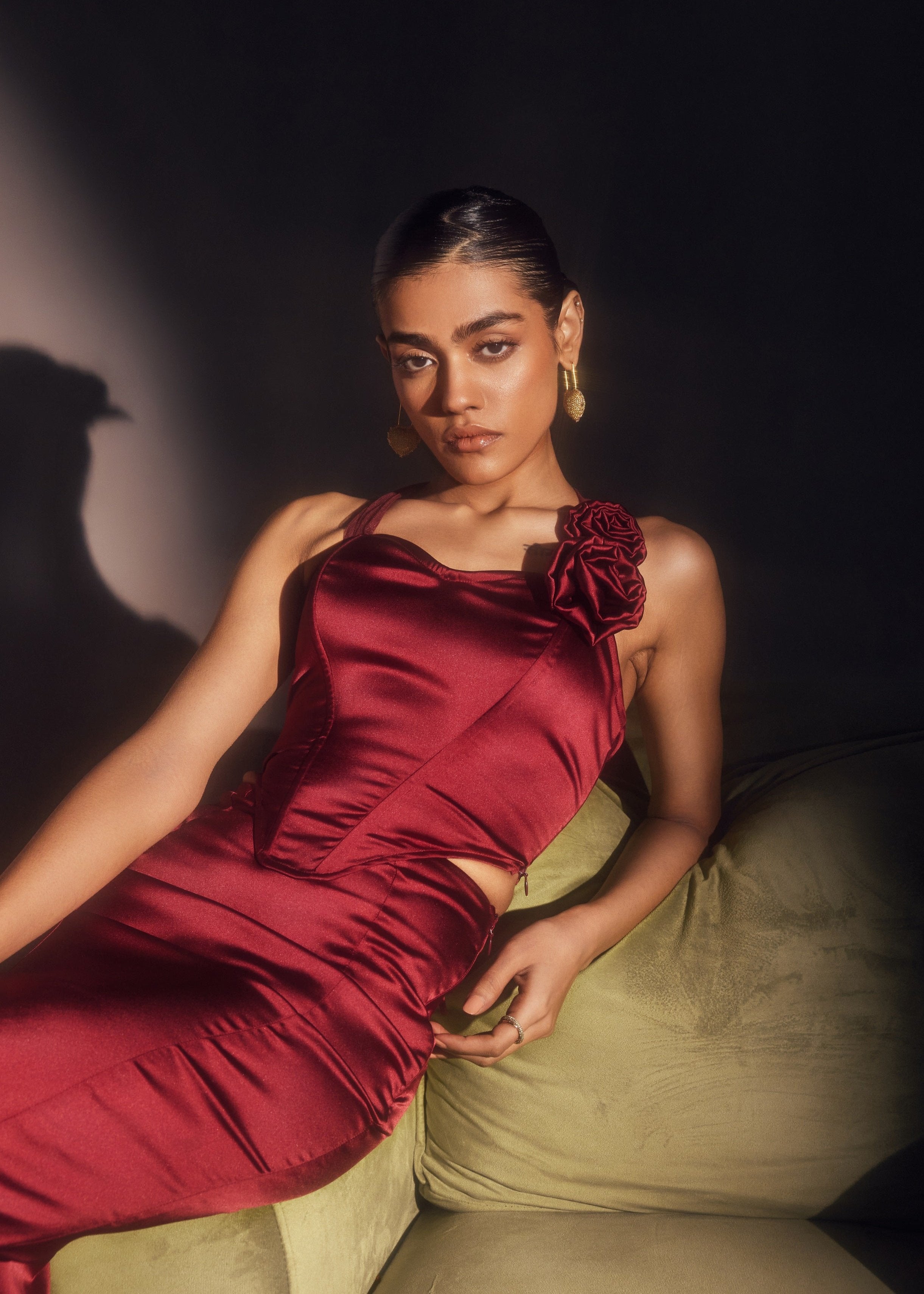 Alina Burgundy Stretch Satin Corset and Midi Skirt Set, offering a sleek satin finish with a chic corset and midi skirt combination