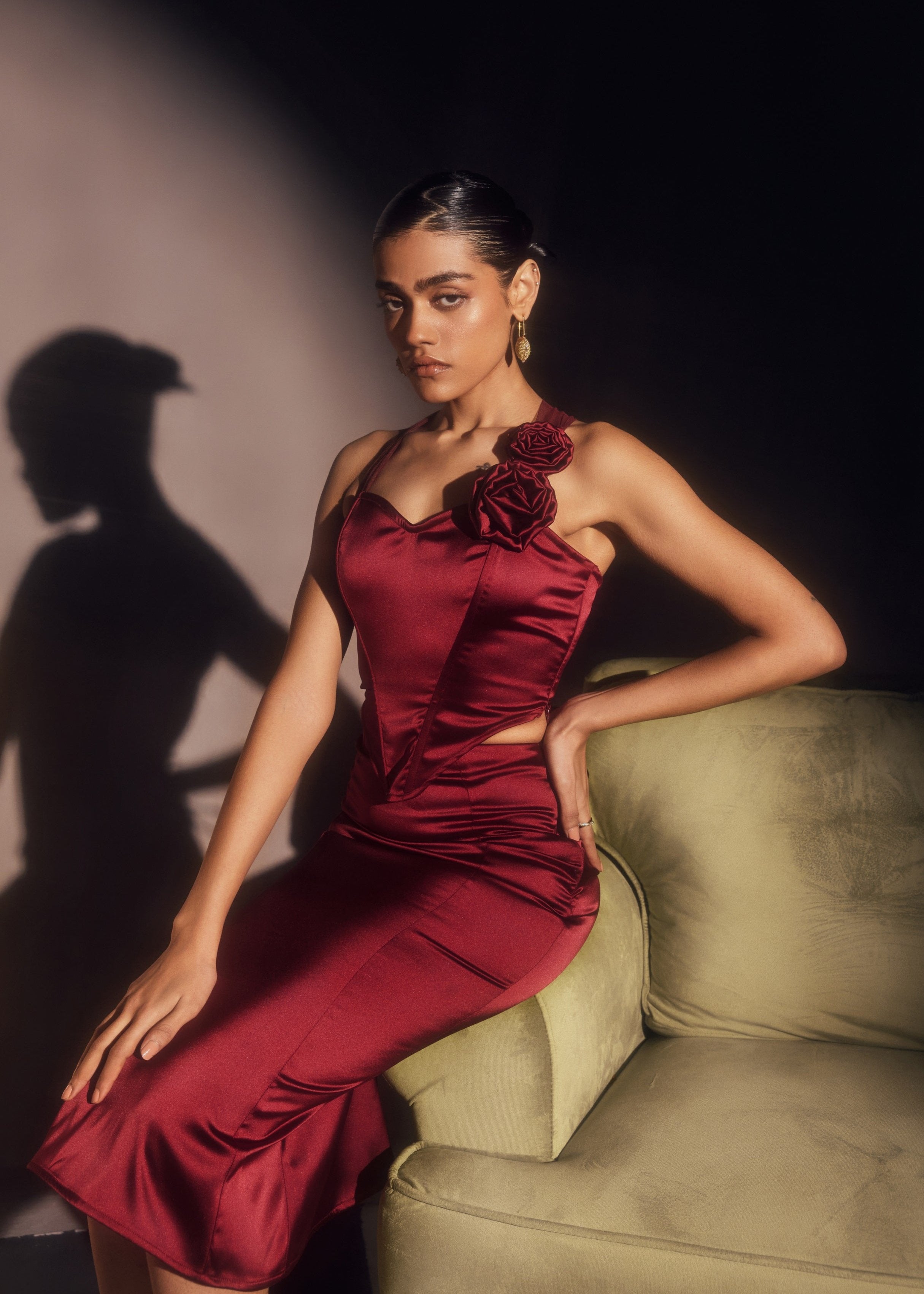 Alina Burgundy Stretch Satin Corset and Midi Skirt Set, offering a sleek satin finish with a chic corset and midi skirt combination