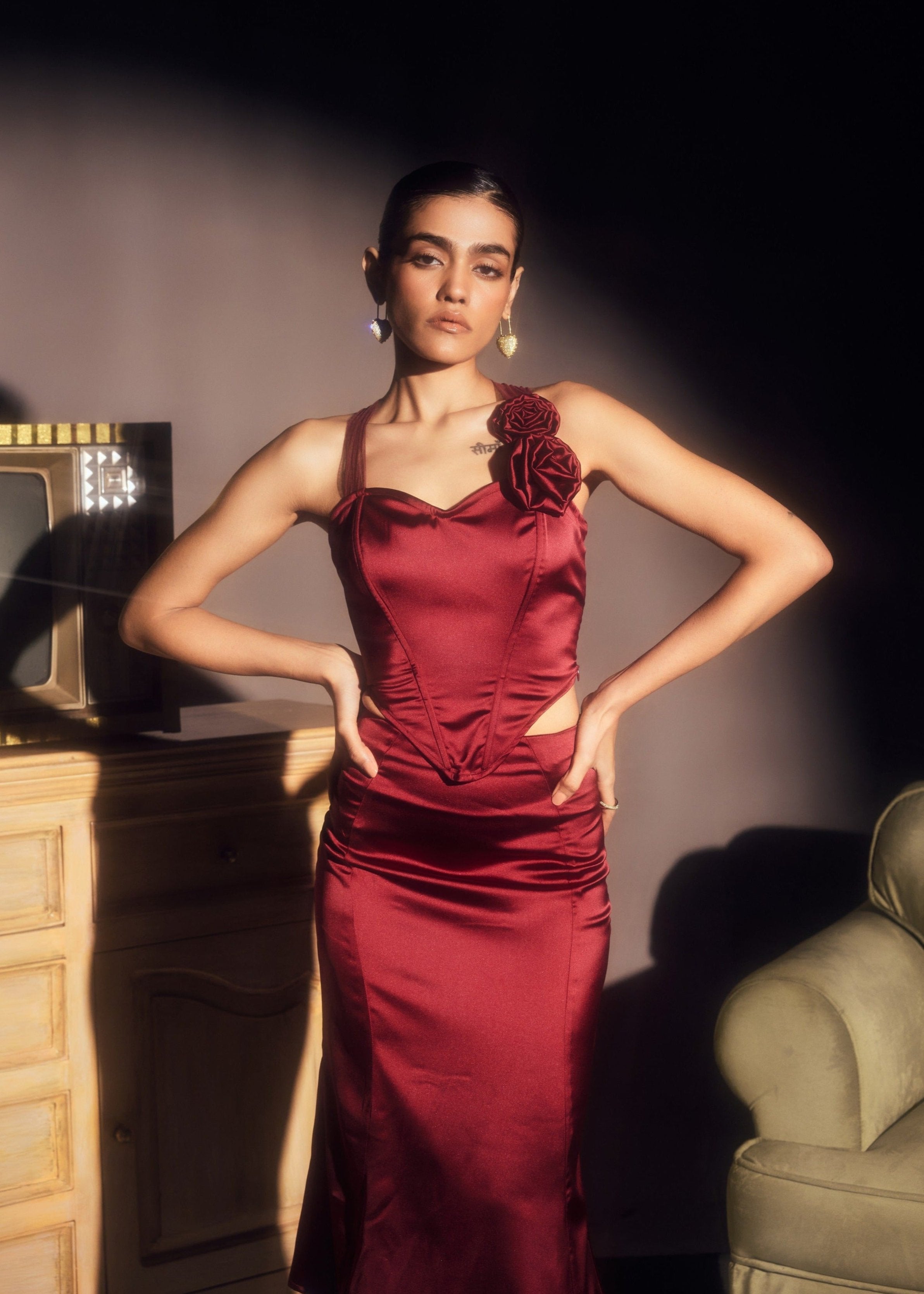 Alina Burgundy Stretch Satin Corset and Midi Skirt Set, offering a sleek satin finish with a chic corset and midi skirt combination