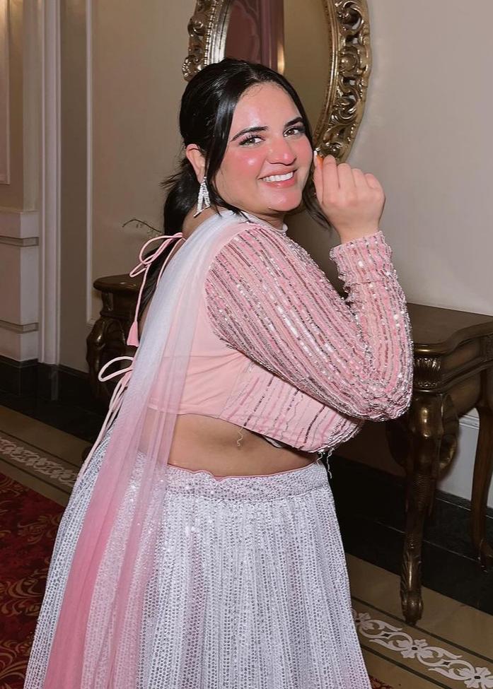 Anaisha Pink Ombre Embroidered Lehenga Set with a gradient pink color and intricate embroidery.