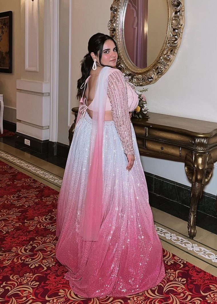 Anaisha Pink Ombre Embroidered Lehenga Set with a gradient pink color and intricate embroidery.