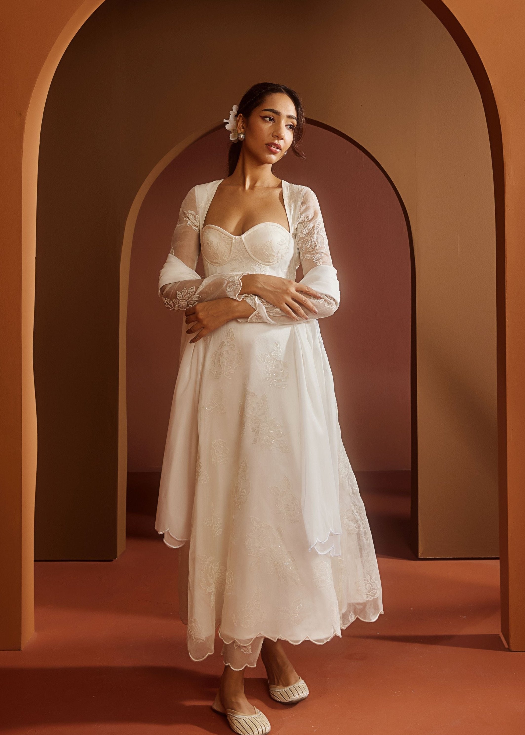 Avya White Embroidered Corset Anarkali Suit featuring intricate embroidery and a fitted corset design for a blend of traditional elegance and modern style