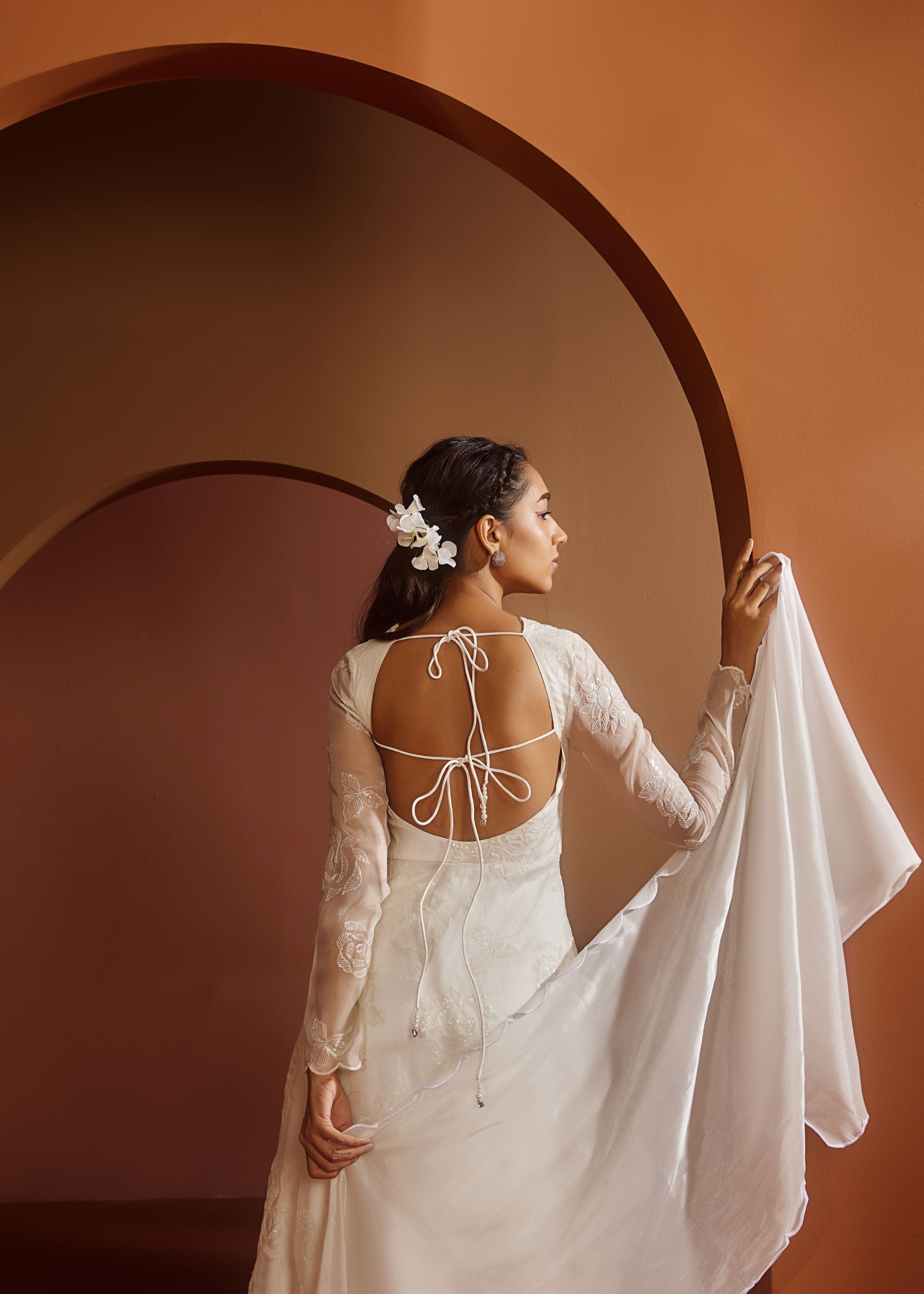 Avya White Embroidered Corset Anarkali Suit featuring intricate embroidery and a fitted corset design for a blend of traditional elegance and modern style