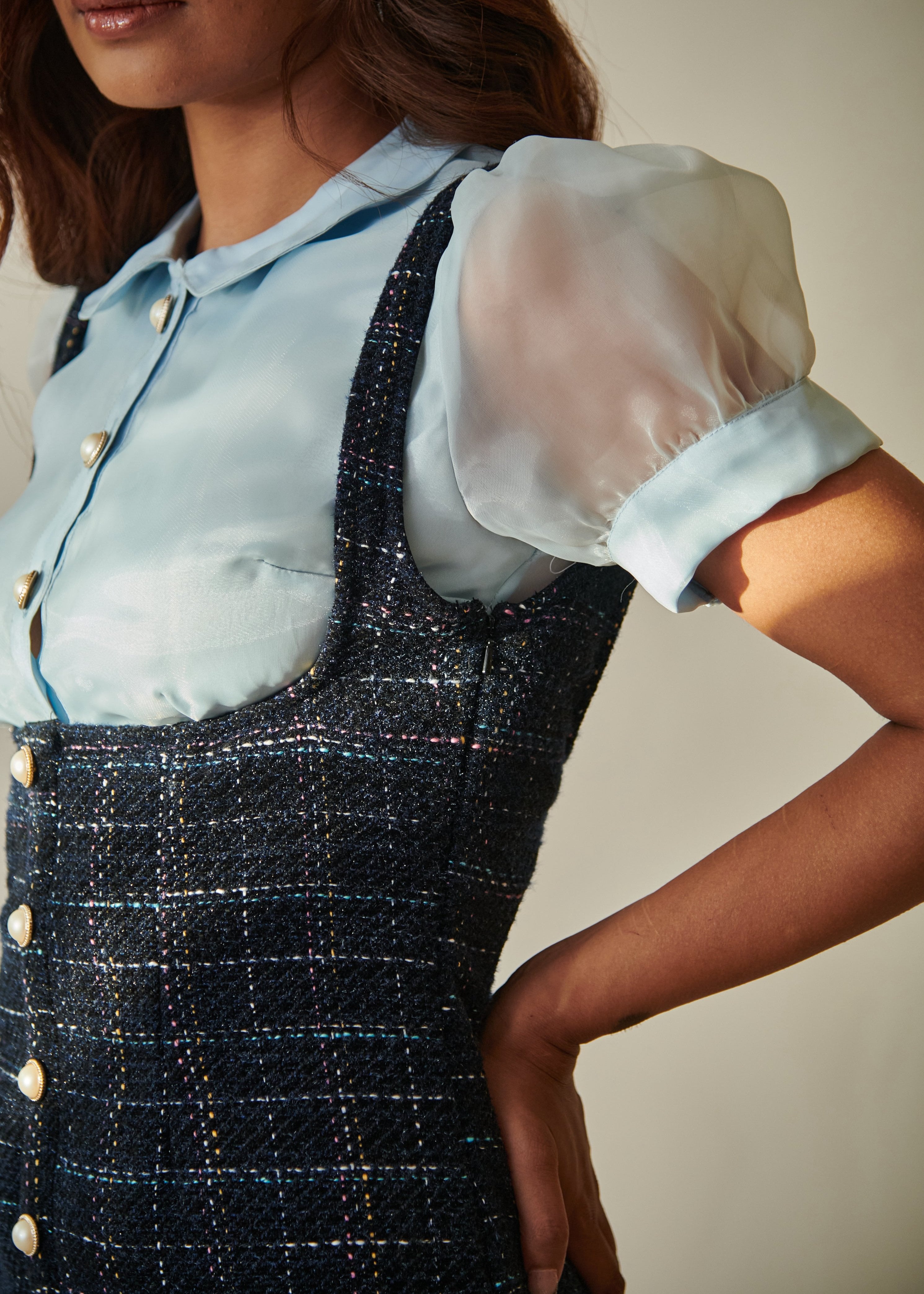 Elegant woman in a Barbara Blue Tweed Pinafore Dress and Organza Shirt Set, showcasing a blend of classic and contemporary style