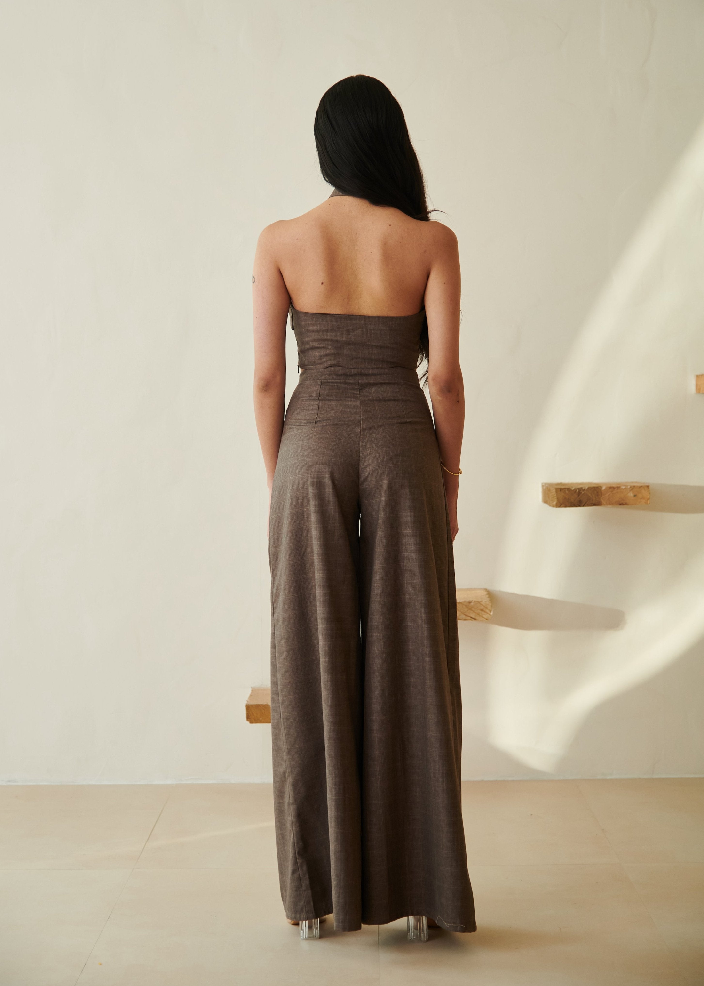 Fashionable woman in a Belinda Brown Halter Crop Top and Wide Leg Pants Set, showcasing chic and contemporary style