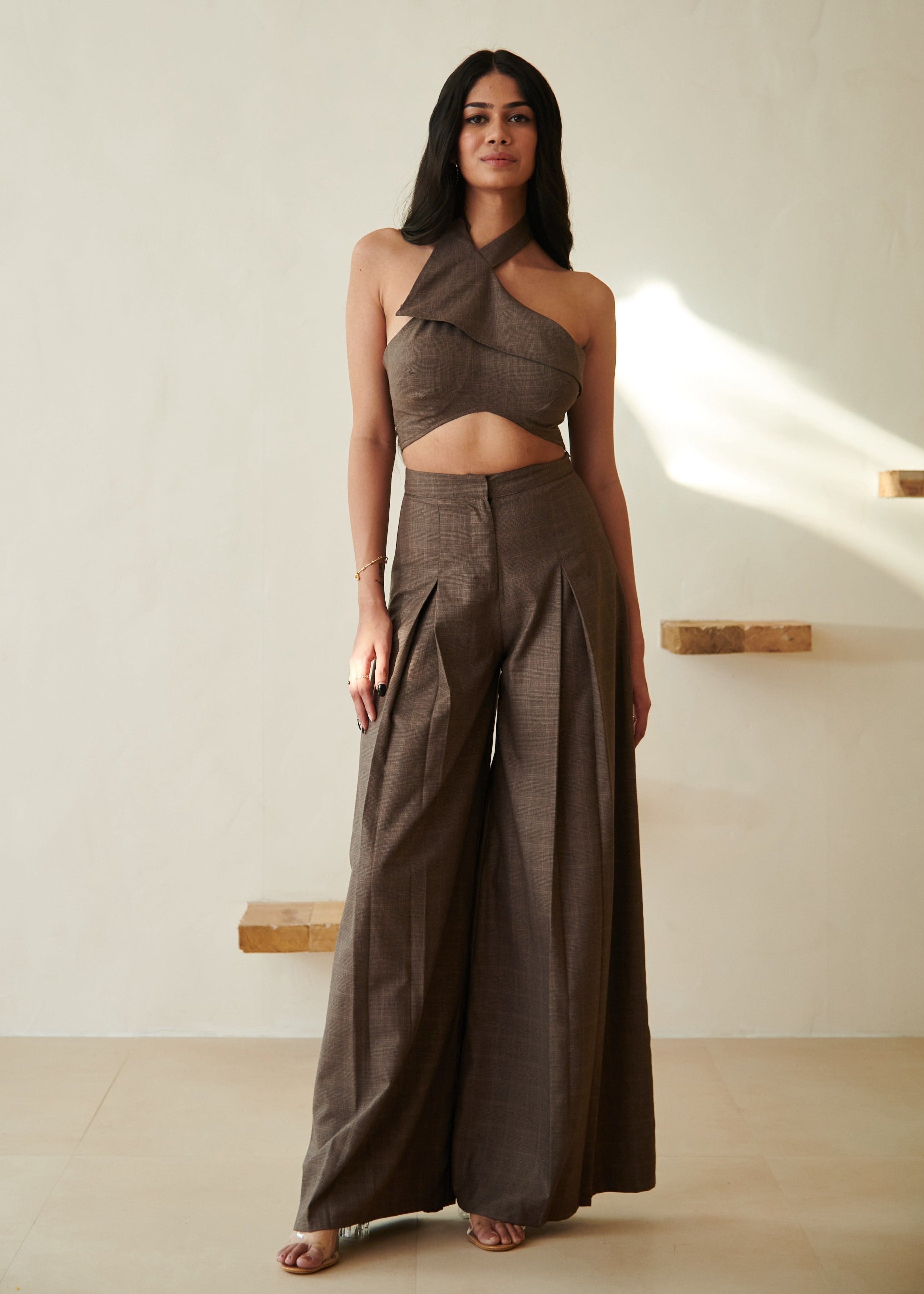 Fashionable woman in a Belinda Brown Halter Crop Top and Wide Leg Pants Set, showcasing chic and contemporary style