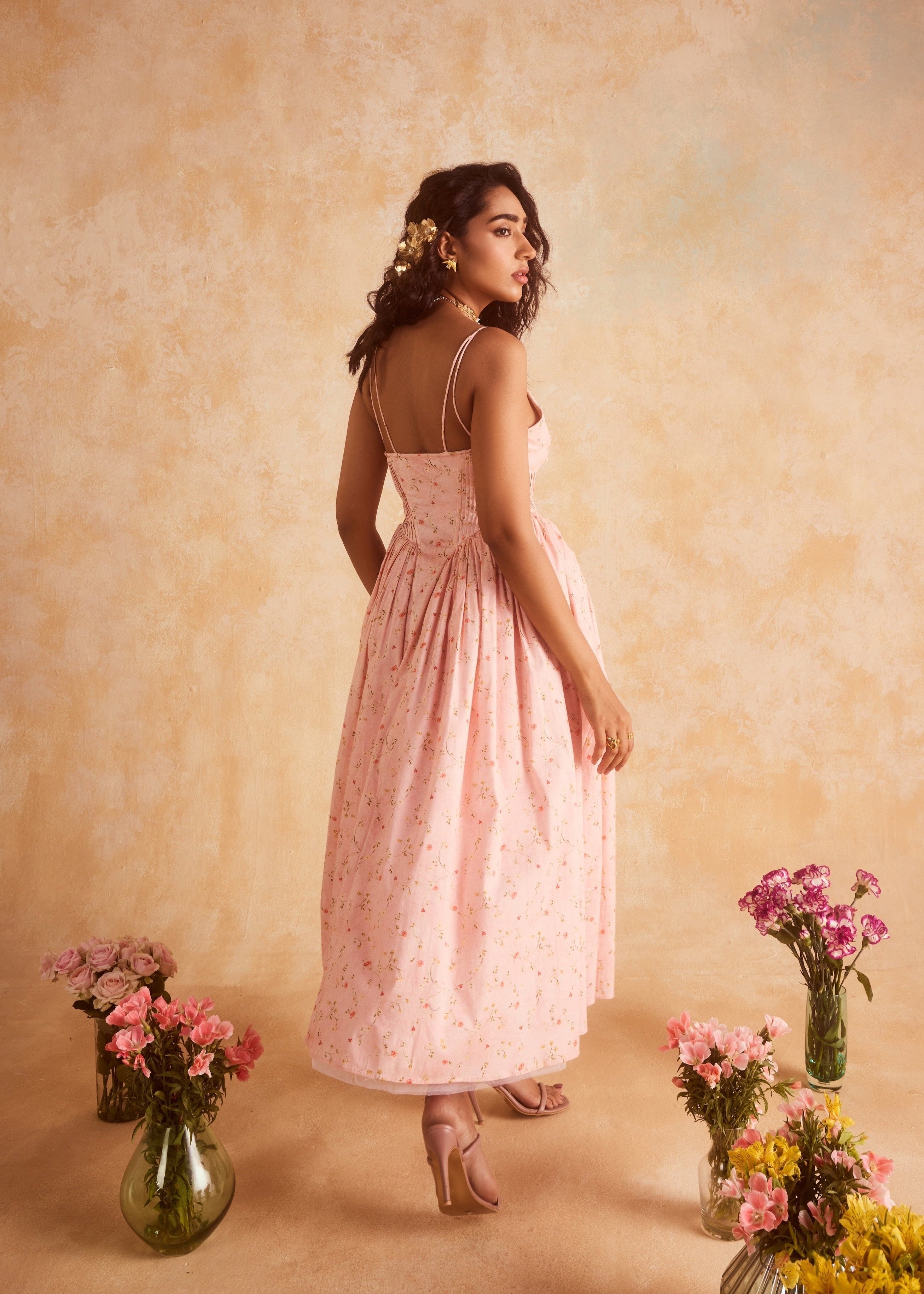 Brynlee Baby Pink Floral Printed Corset Midi Dress, a charming floral-printed dress with a fitted bodice and midi-length skirt in soft baby pink.