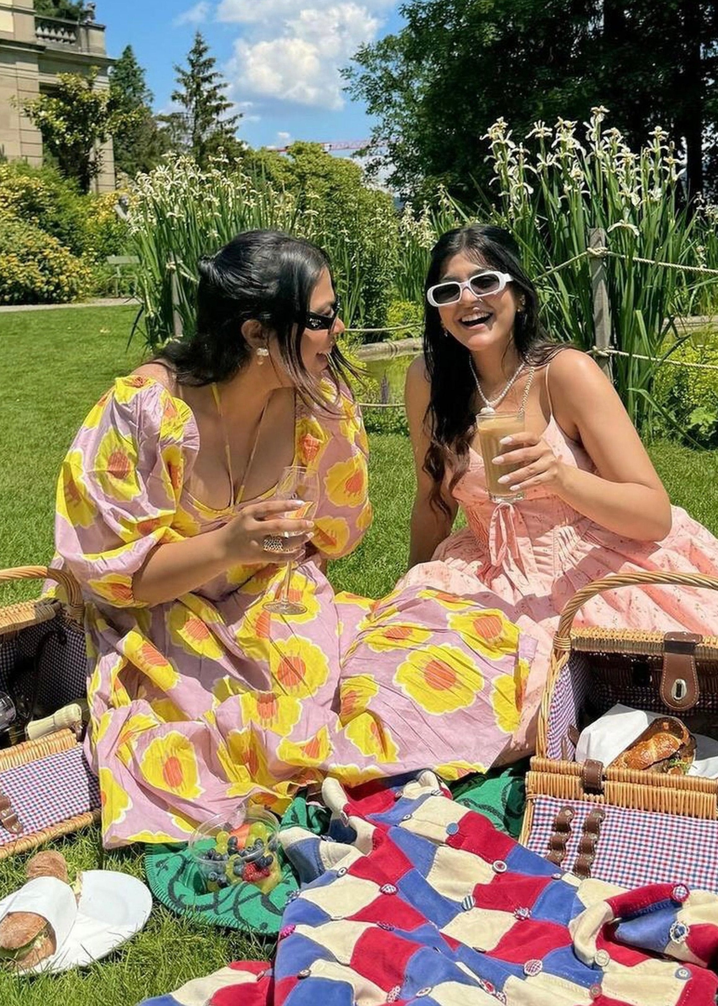 "Brynlee Baby Pink Floral Printed Corset Midi Dress: Charming baby pink midi dress with a floral print and a fitted corset top."