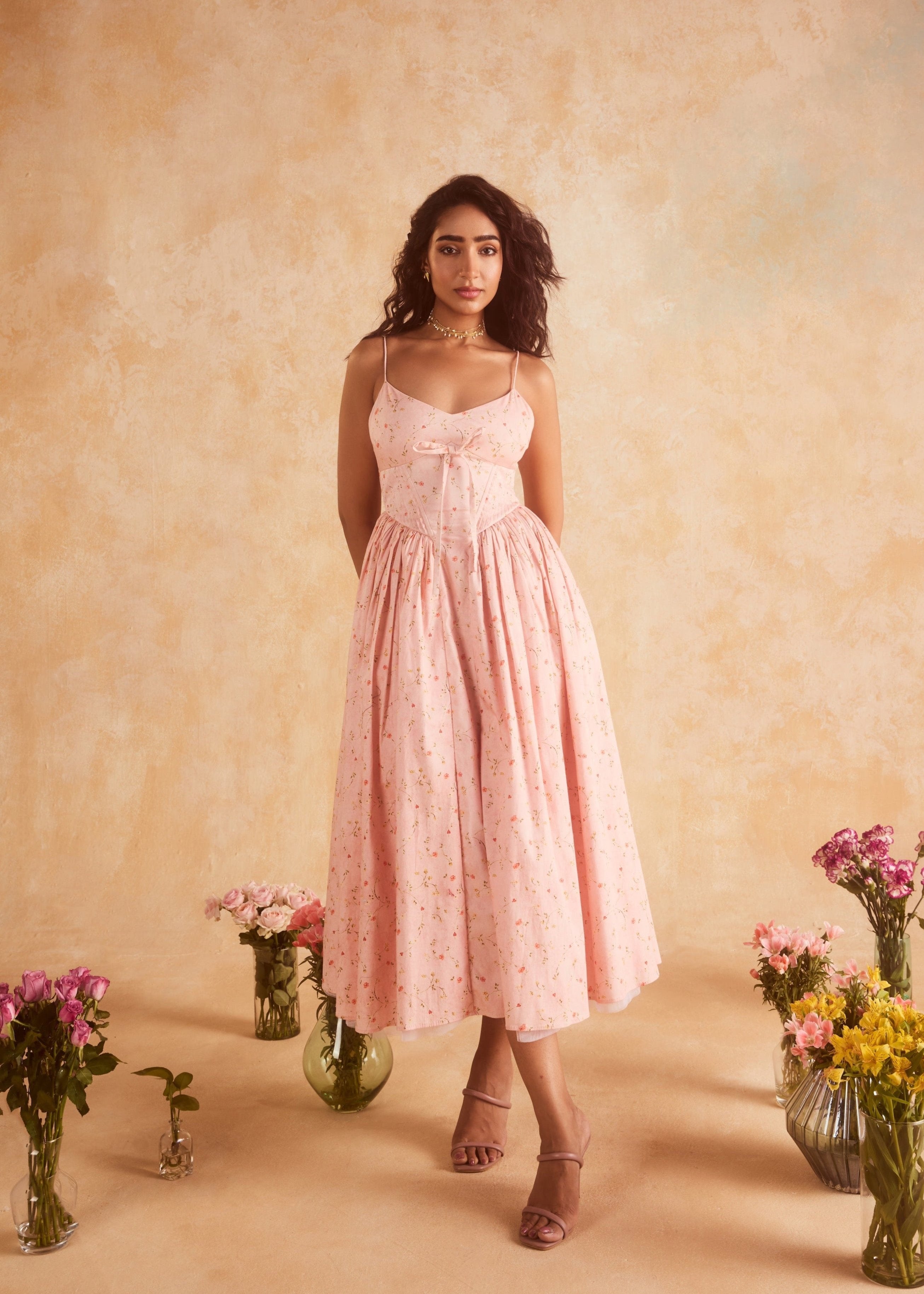 Brynlee Baby Pink Floral Printed Corset Midi Dress, a charming floral-printed dress with a fitted bodice and midi-length skirt in soft baby pink.