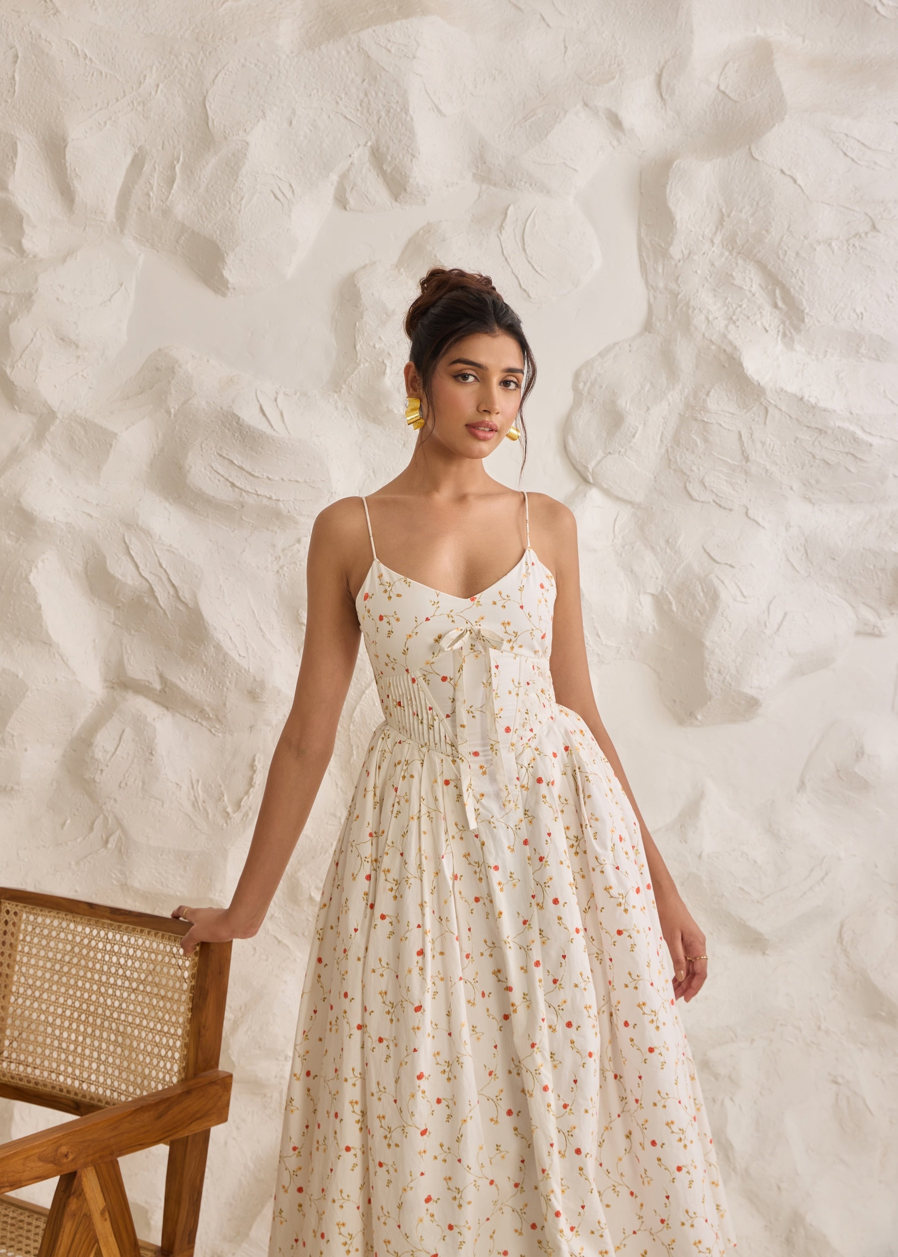 A graceful Brynlee white midi dress featuring a floral print and a corset bodice.