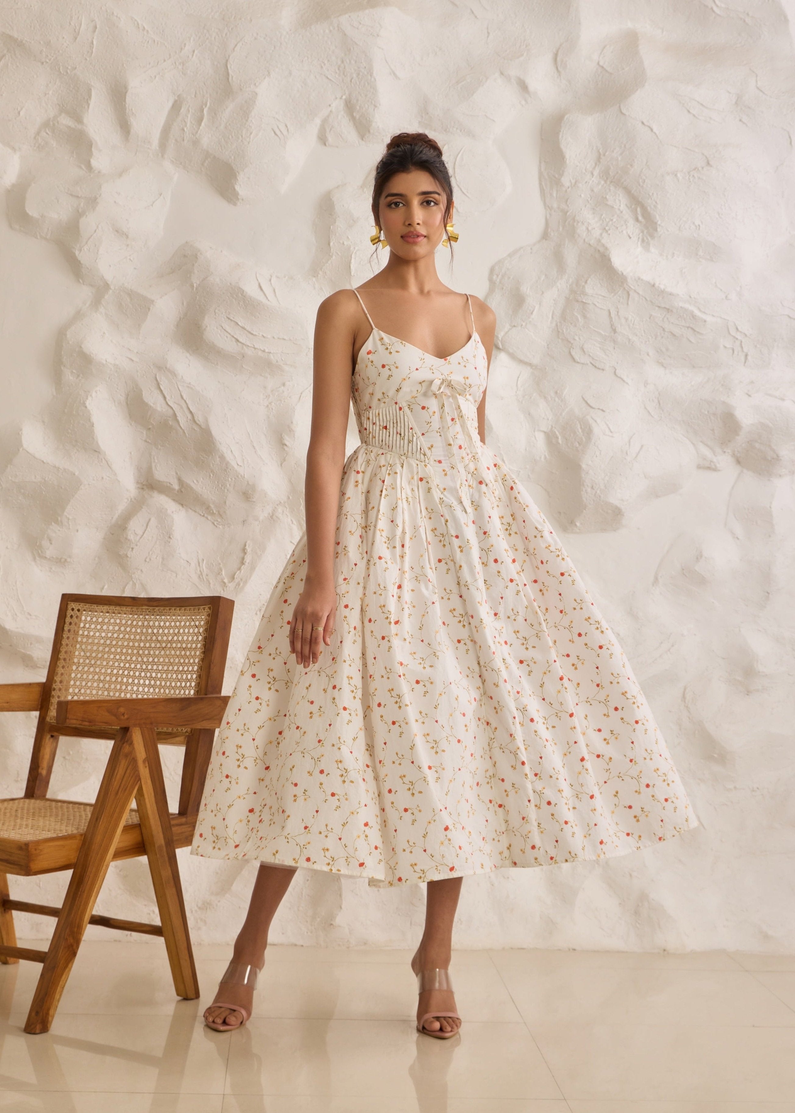 A graceful Brynlee white midi dress featuring a floral print and a corset bodice.