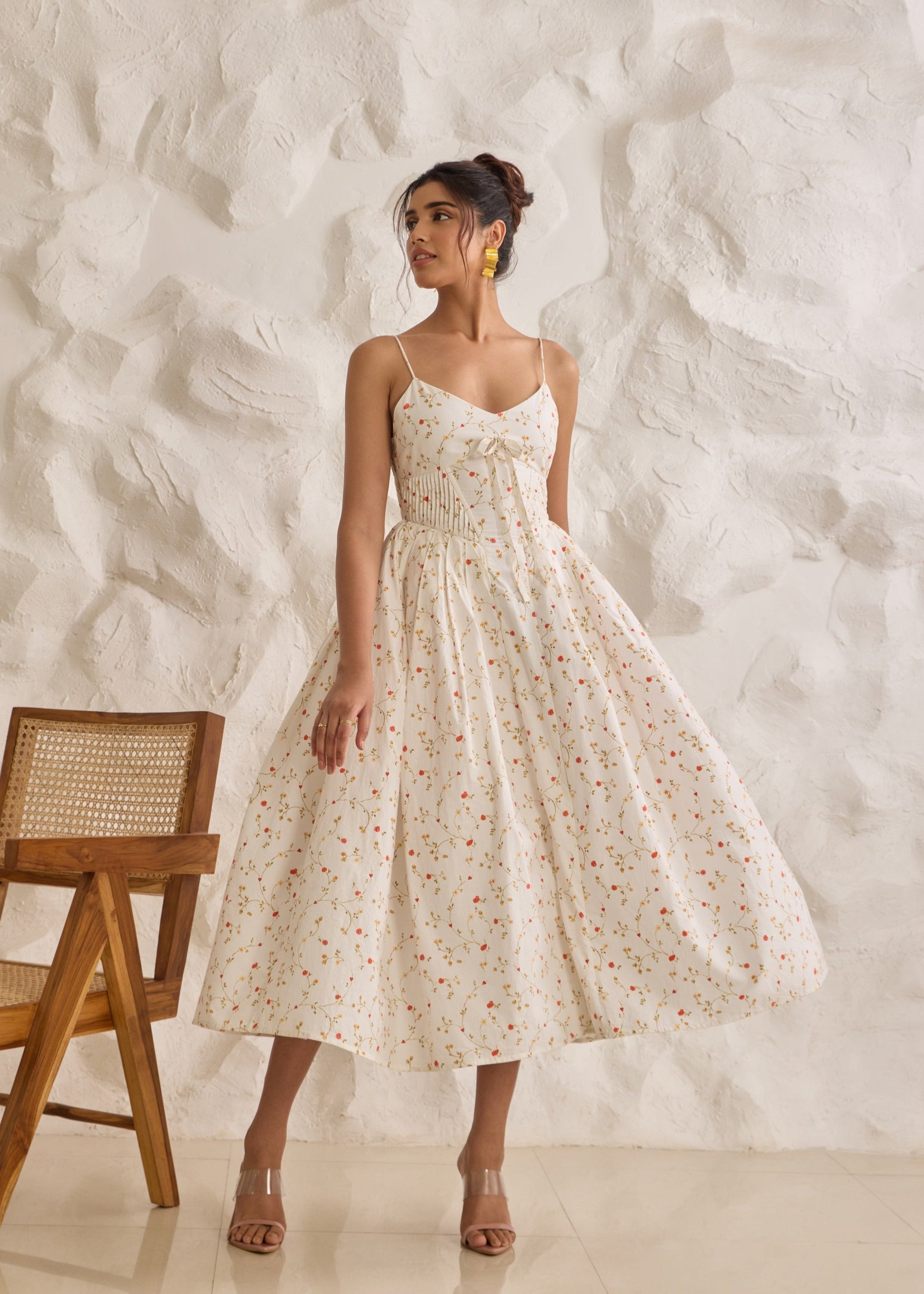 A graceful Brynlee white midi dress featuring a floral print and a corset bodice.