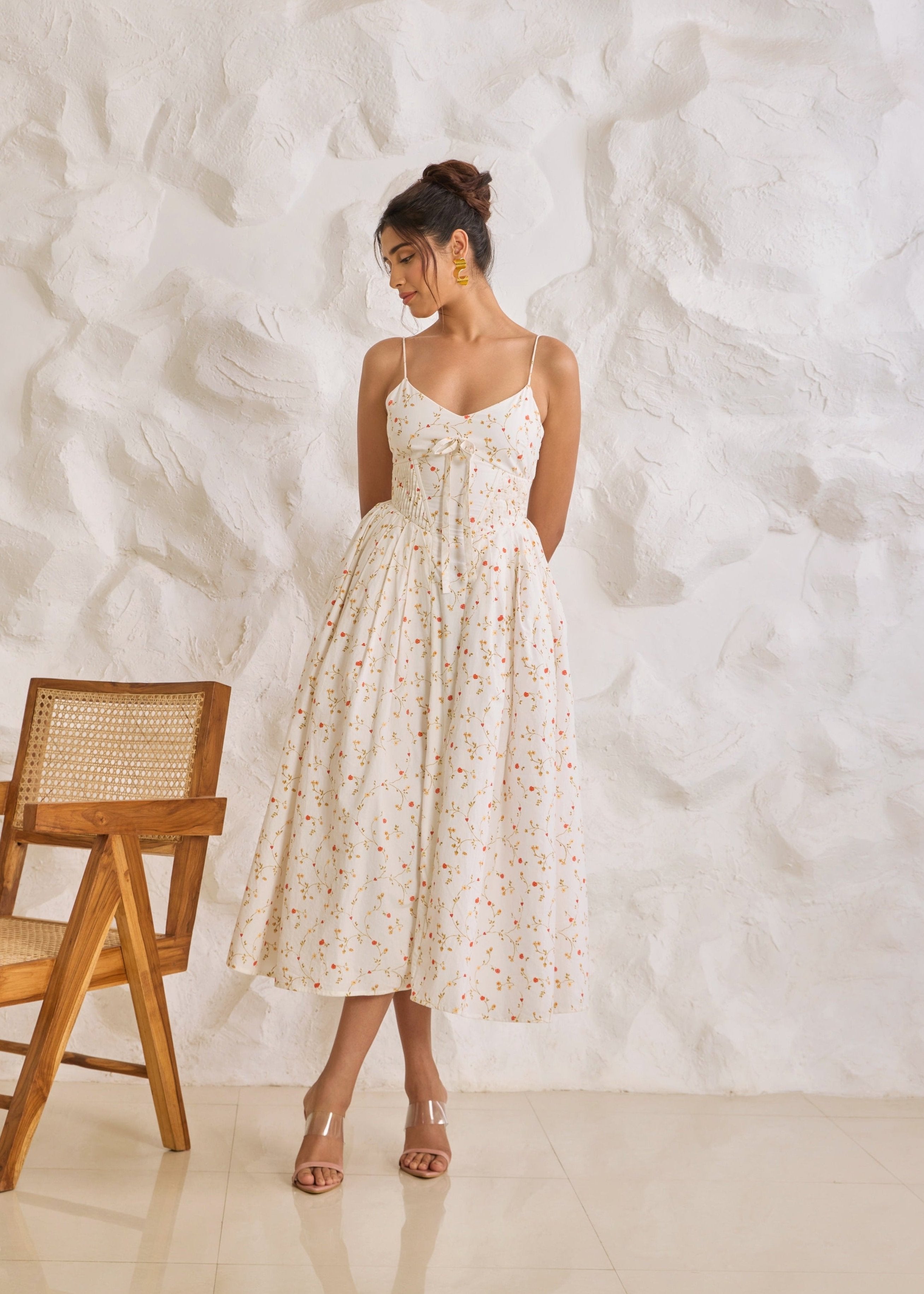 A graceful Brynlee white midi dress featuring a floral print and a corset bodice.