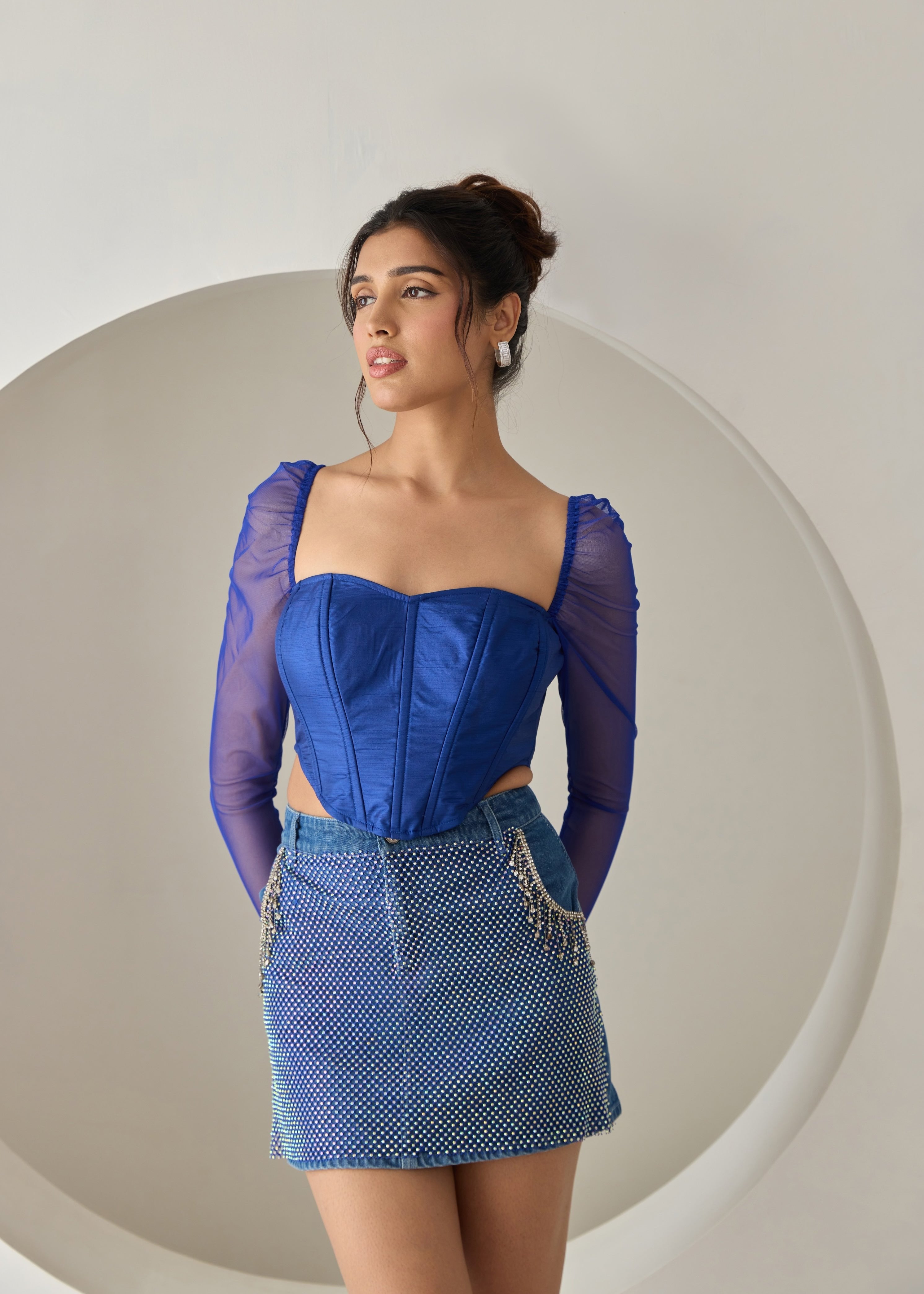 A dark blue silk corset top.