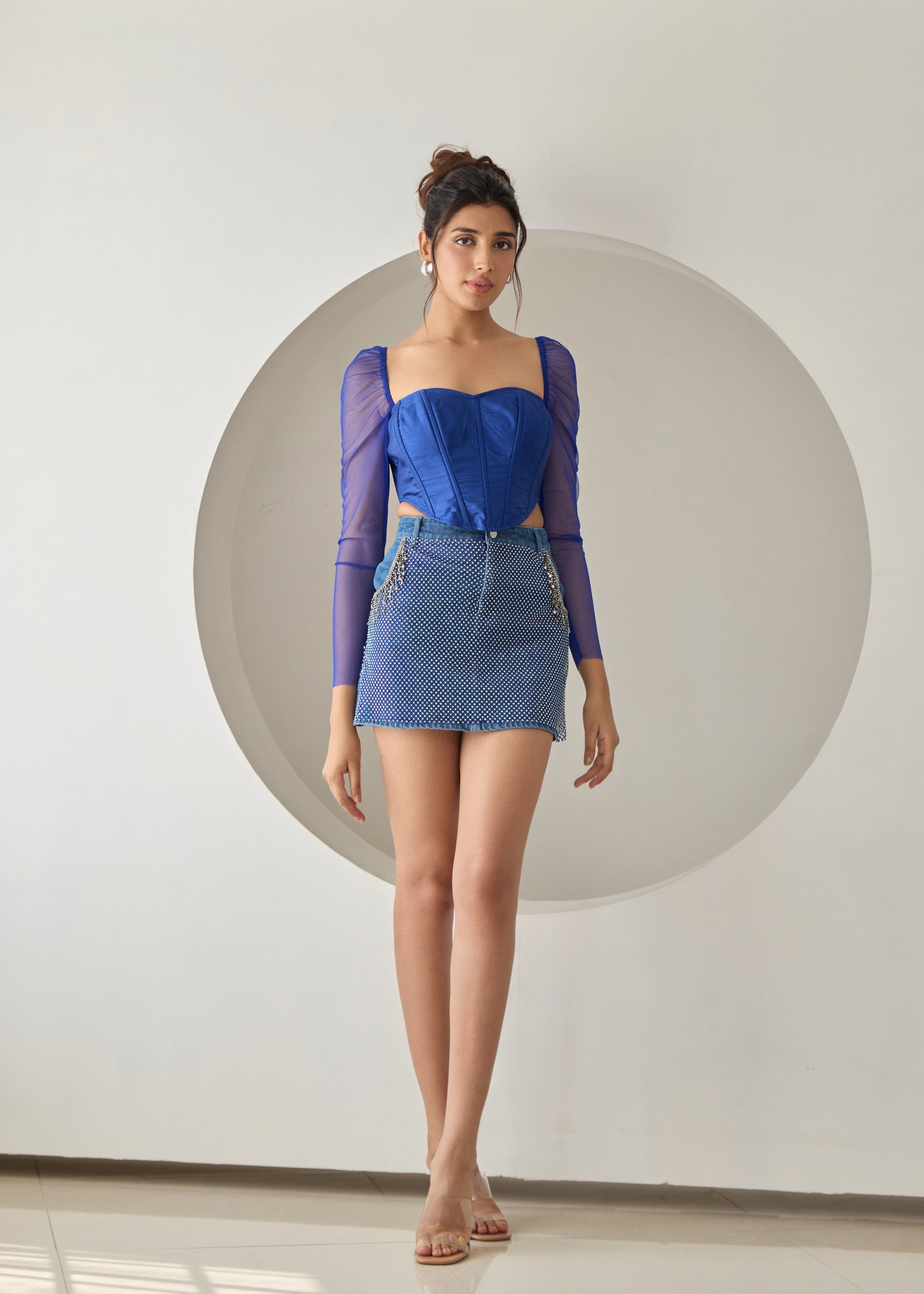 A dark blue silk corset top.