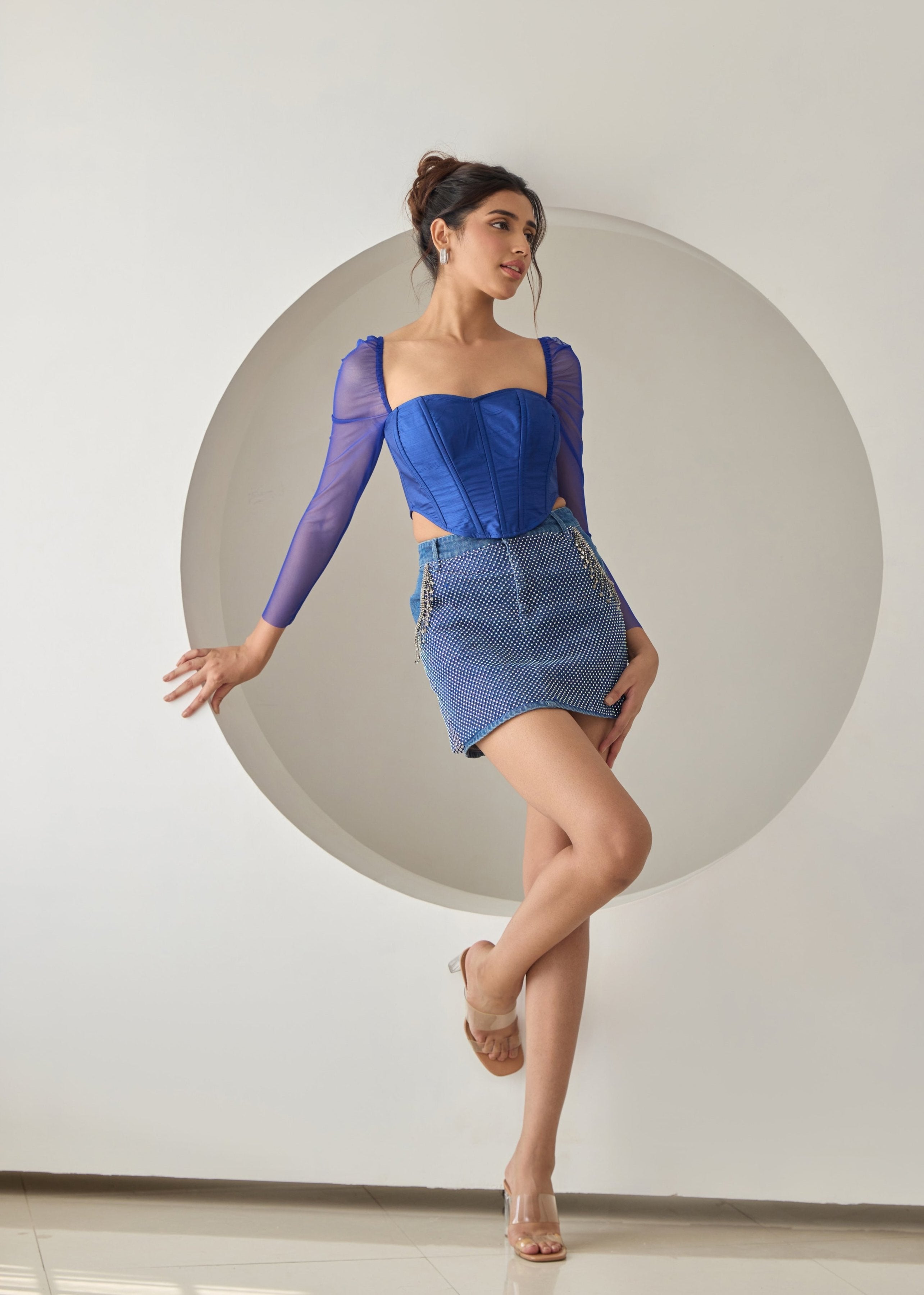 A dark blue silk corset top.