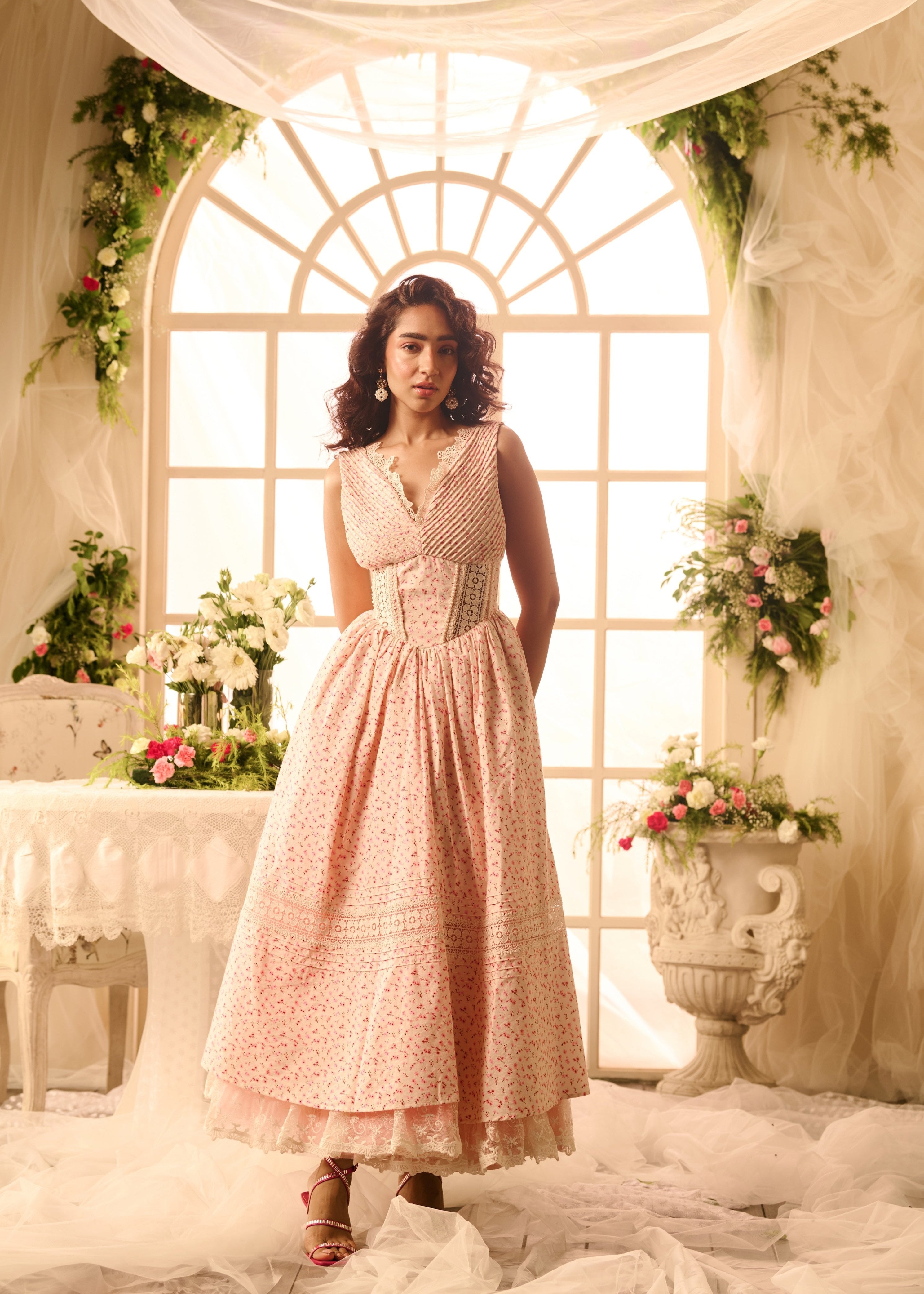 Carmine Baby Pink Floral Printed Corset Maxi Dress featuring a fitted bodice, delicate floral print, and flowing maxi-length skirt