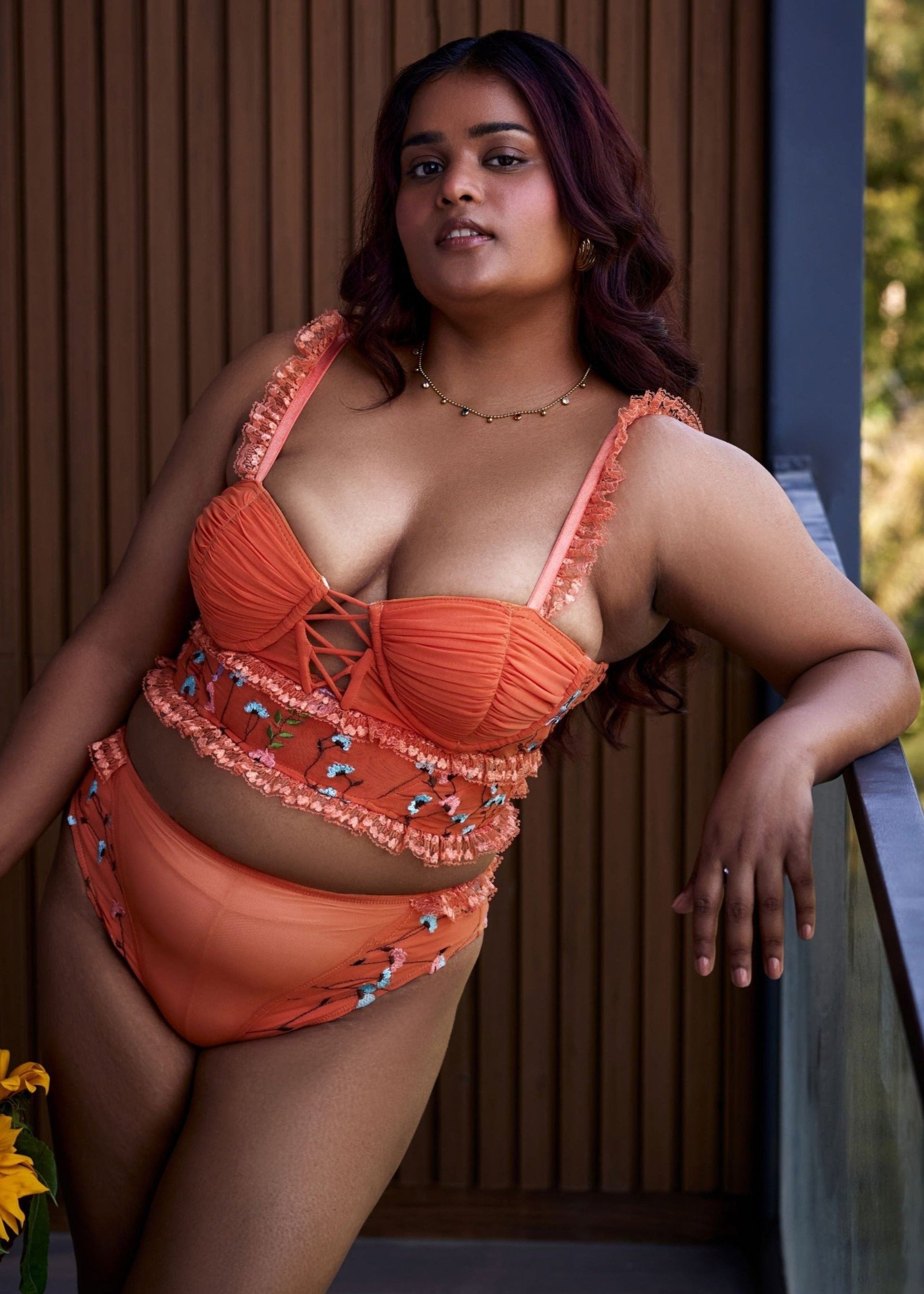 "Cassandra Orange Floral Embroidered High-Rise Briefs with Intricate Detail."