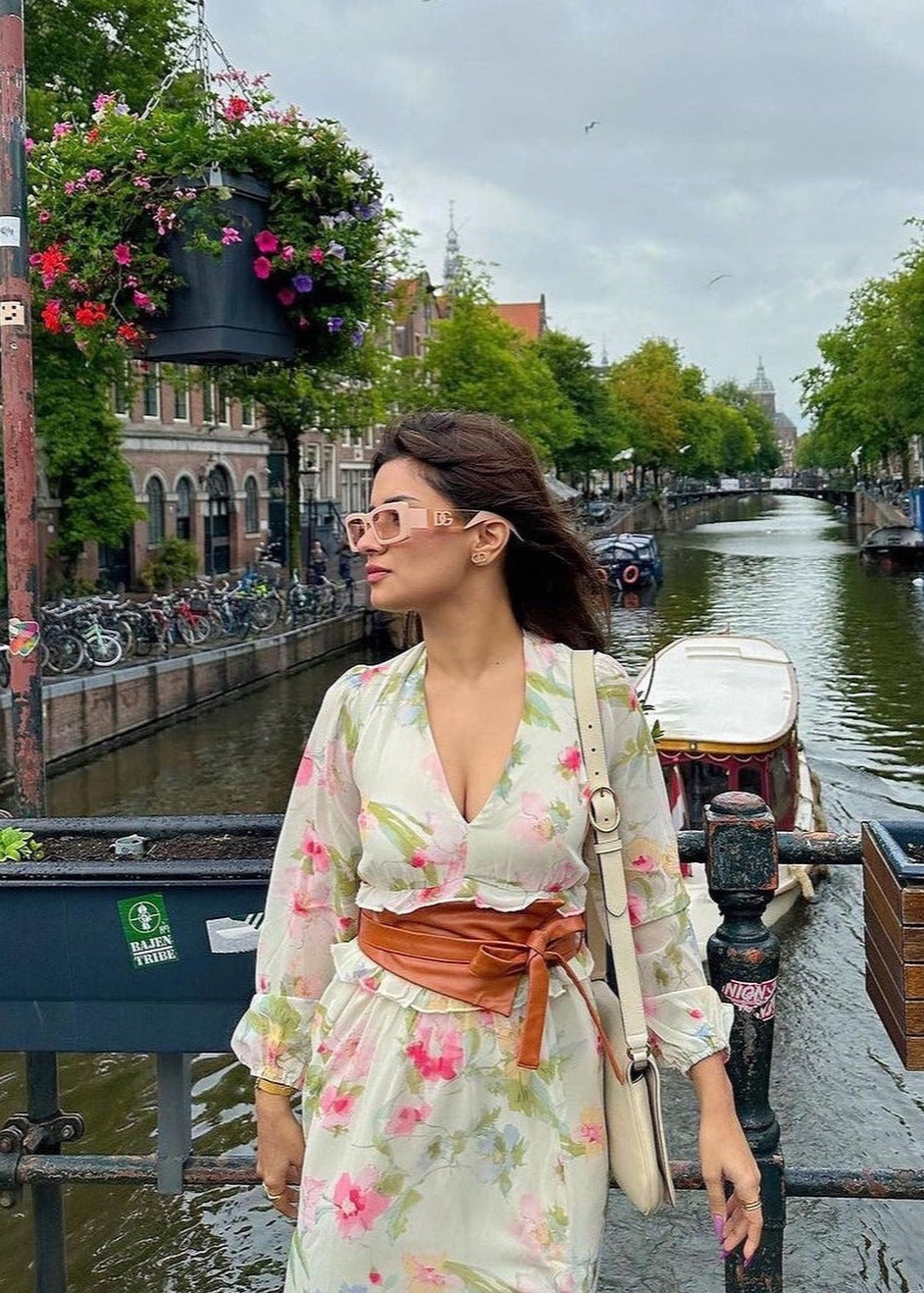 Fashionable woman wearing a Corelle Tan Faux Leather Belt, adding a stylish touch to her outfit