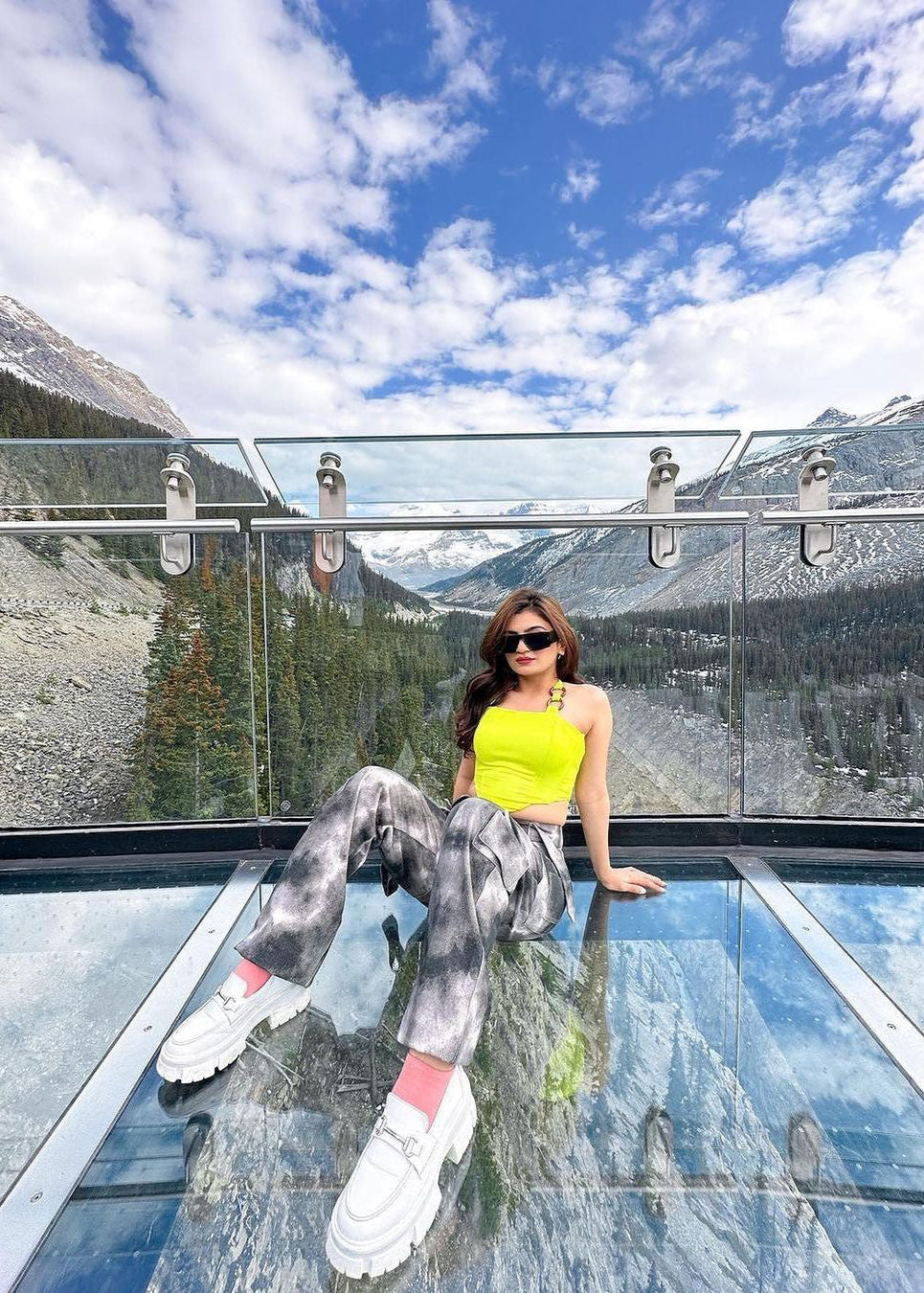 Stylish woman in a Danae Green Asymmetrical Corset Top, exuding modern flair