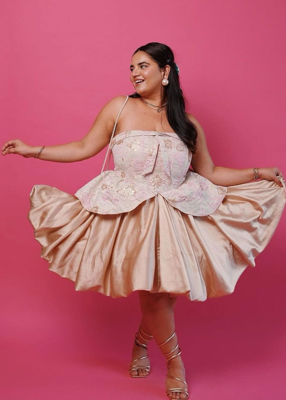 A glamorous Emersyn blush and gold embroidered jacquard mini dress with puff and a corset bodice.