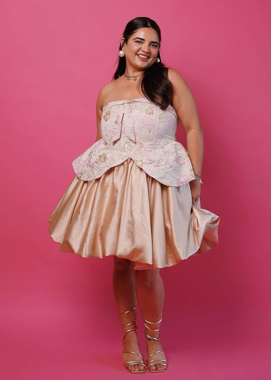 A glamorous Emersyn blush and gold embroidered jacquard mini dress with puff and a corset bodice.