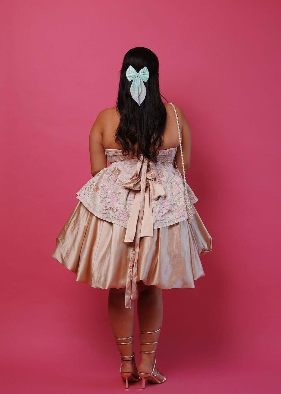 A glamorous Emersyn blush and gold embroidered jacquard mini dress with puff and a corset bodice.