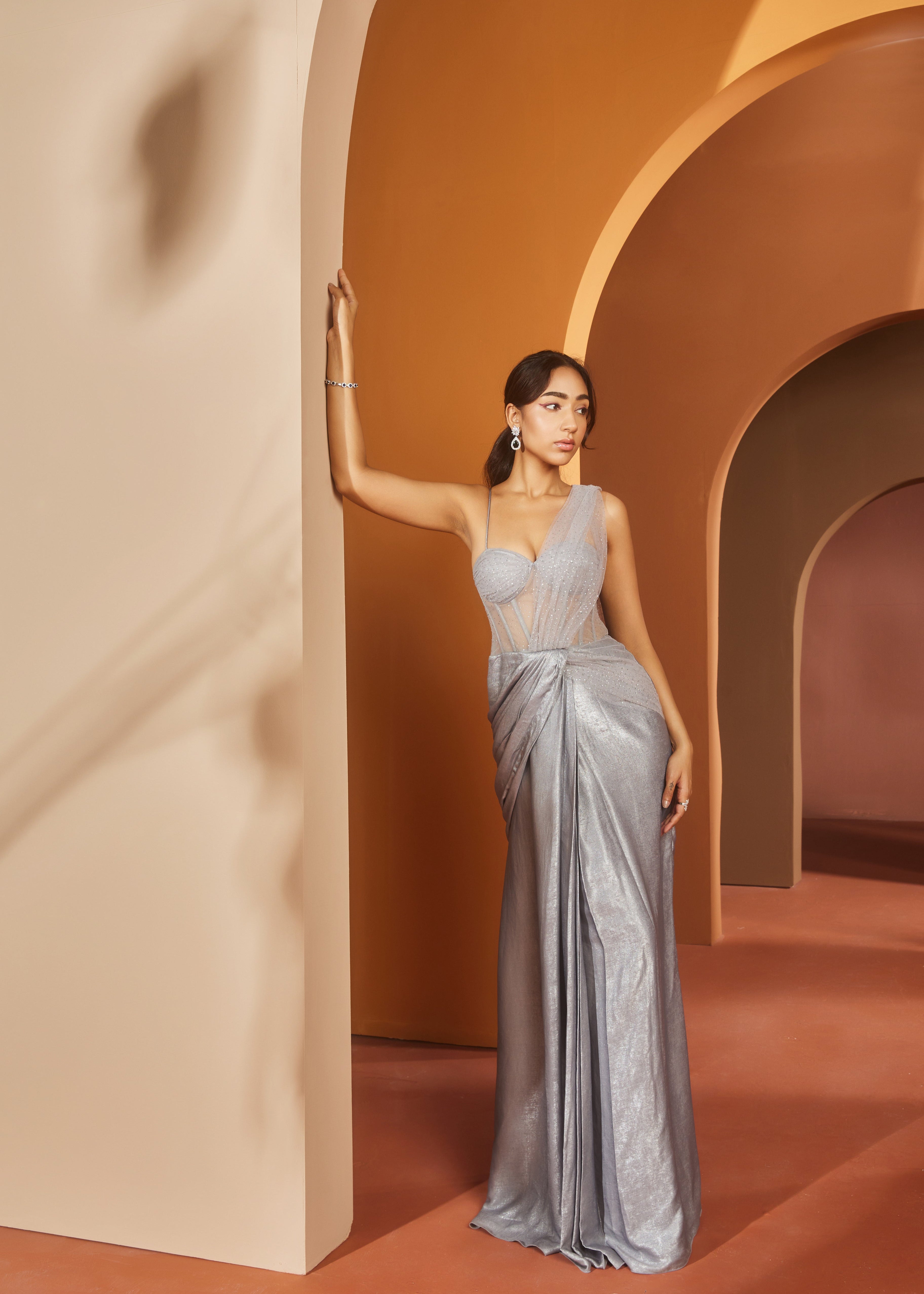 Elegant woman in a Faizah Grey Glitter Georgette One-Piece Saree Set, shimmering with sophistication