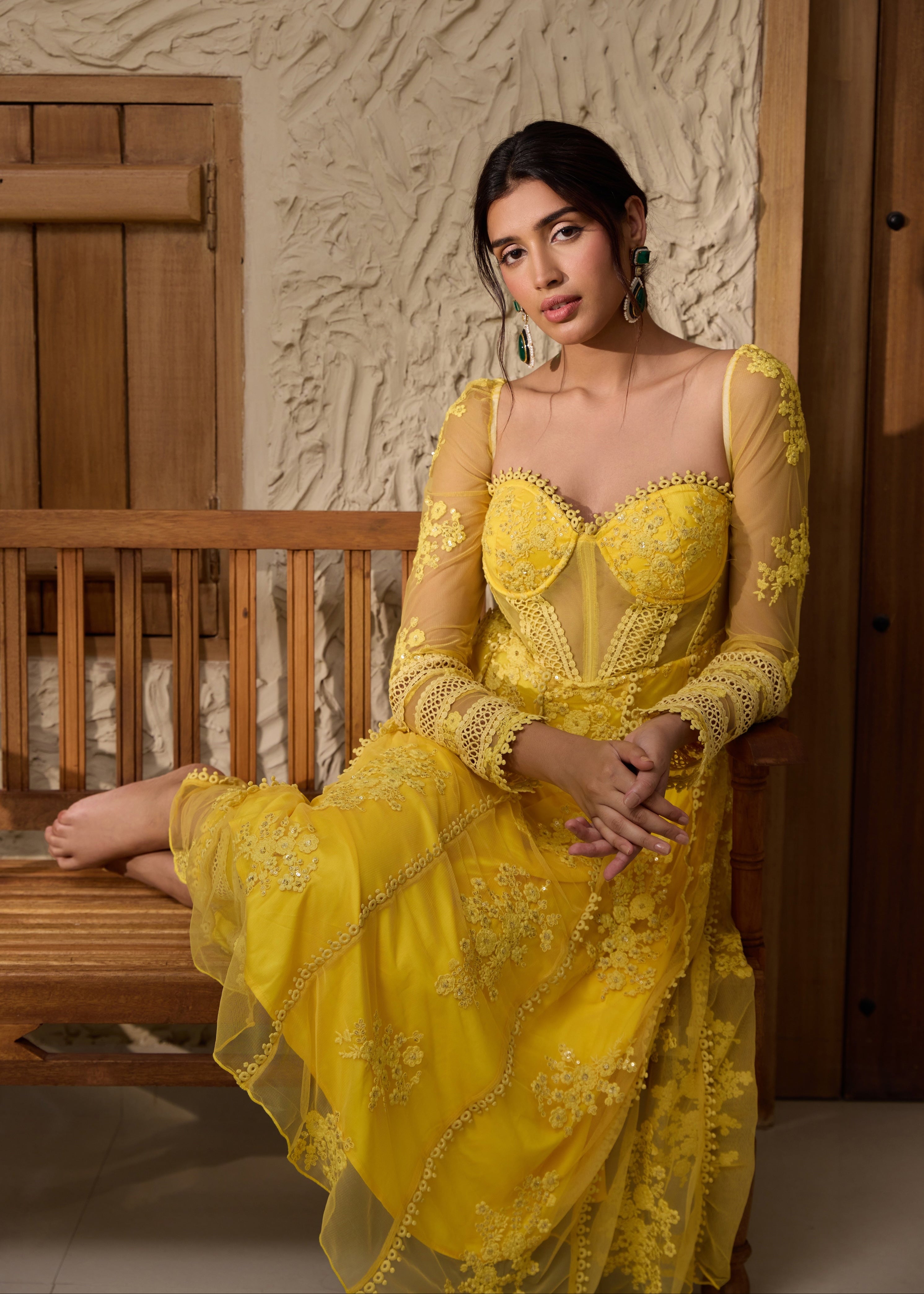 A yellow Anarkali suit set with an embroidered corset top.