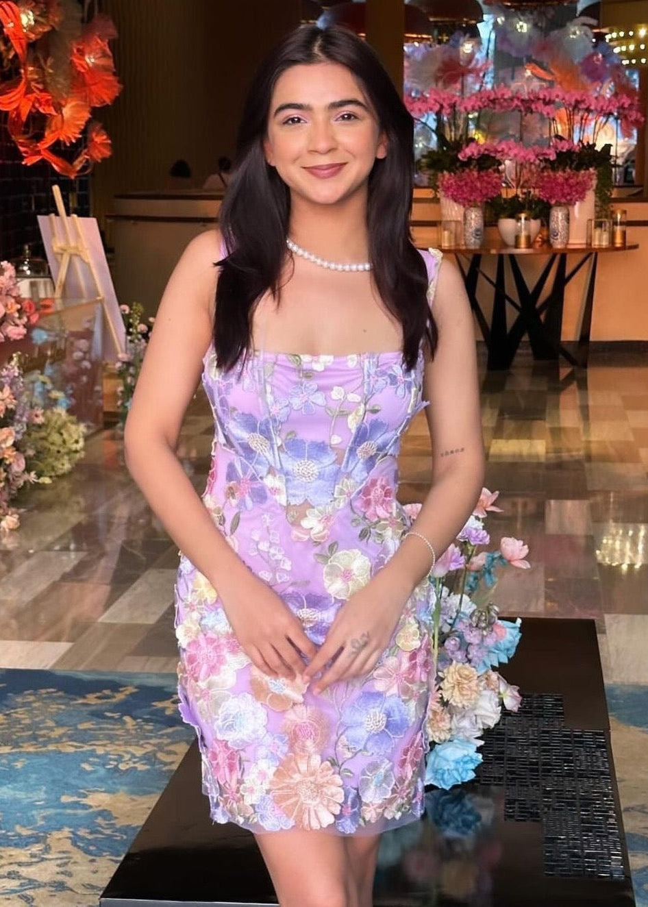 A beautiful Flor Lavender 3-D Flower Embroidered Corset Dress adorned with delicate floral details, ideal for an elegant and feminine appearance.