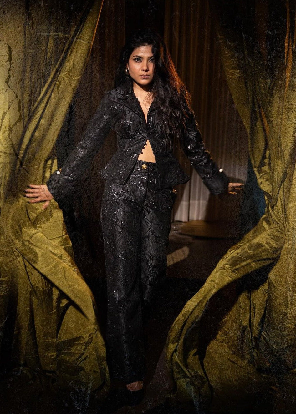 Elegant Jessica black pants featuring intricate jacquard embroidery.