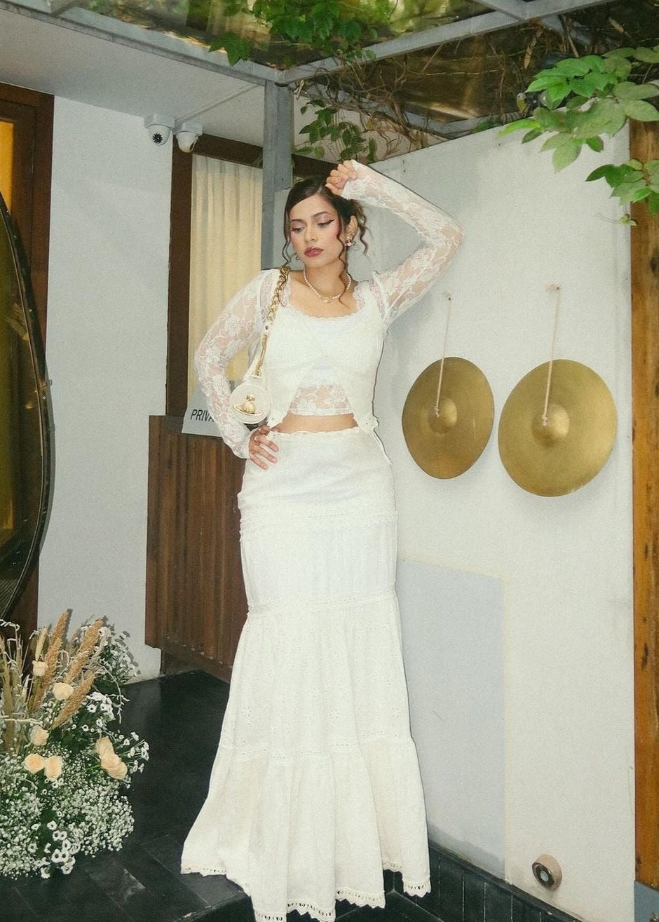 "Journee White Embroidered Cotton Top and Skirt Set: Fresh and airy white cotton set with intricate embroidery, including a top and skirt."