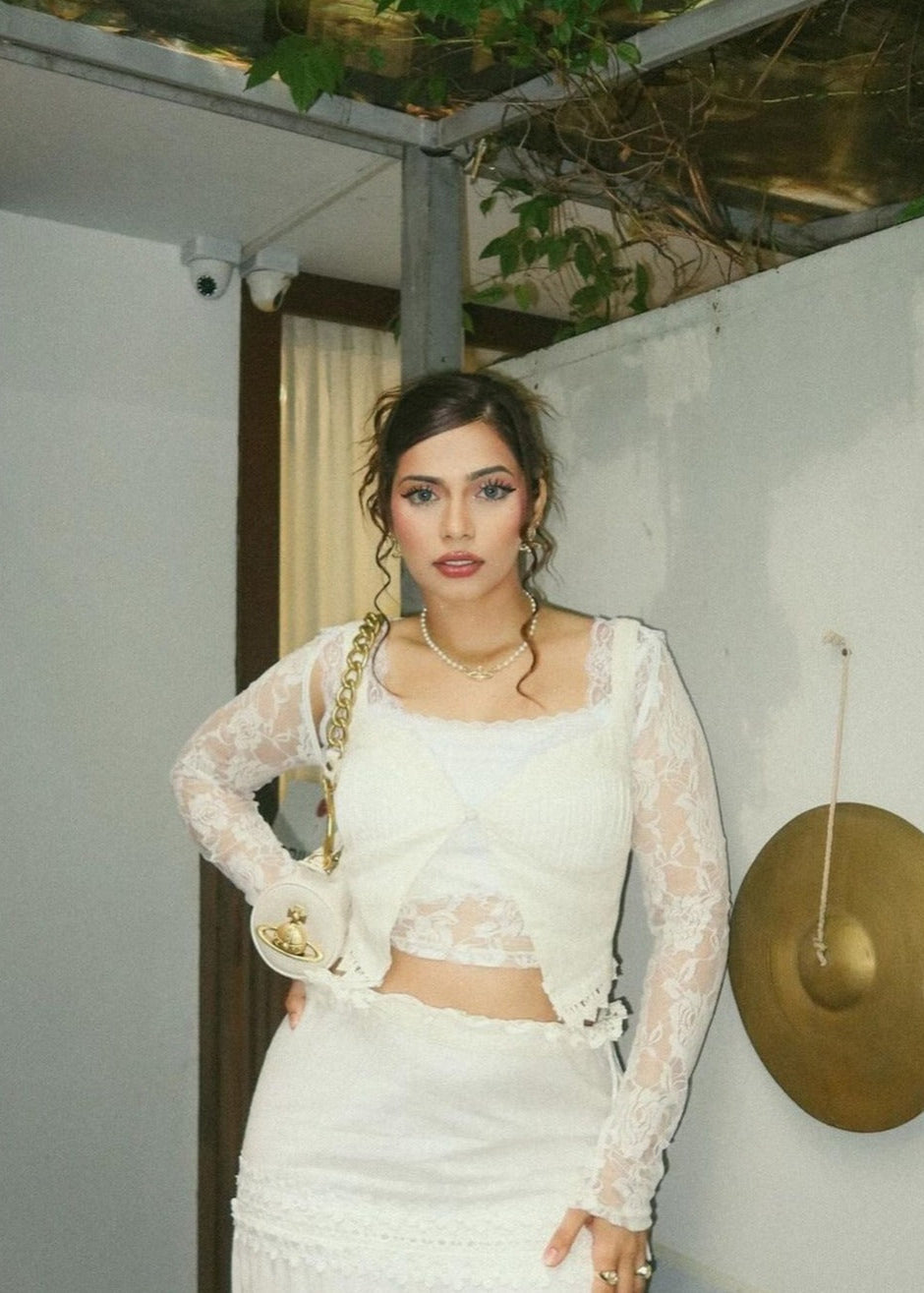 "Journee White Embroidered Cotton Top and Skirt Set: Fresh and airy white cotton set with intricate embroidery, including a top and skirt."