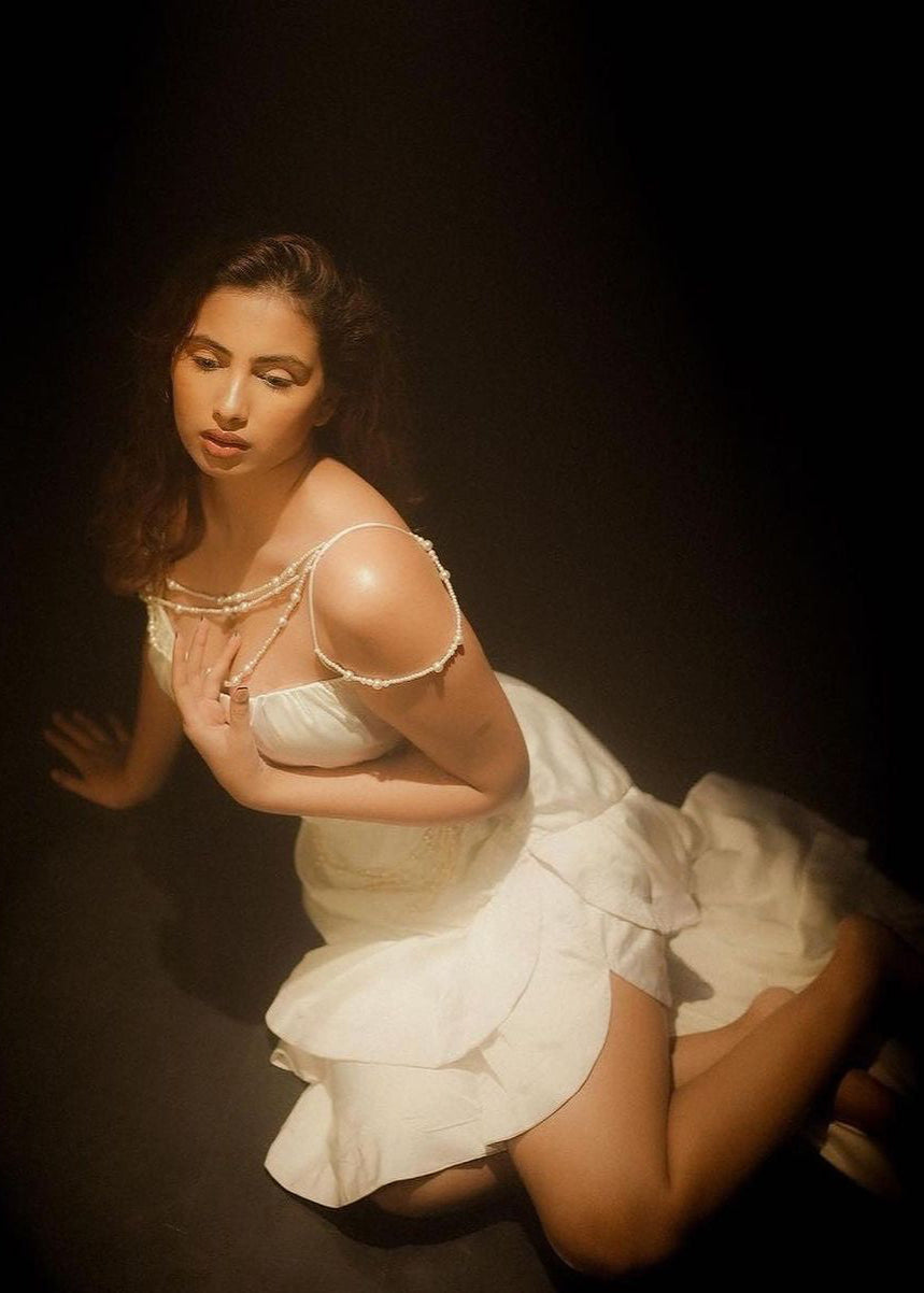 Elegant woman in a Linea White Satin and Pearl Embroidered Corset Set, exuding timeless sophistication