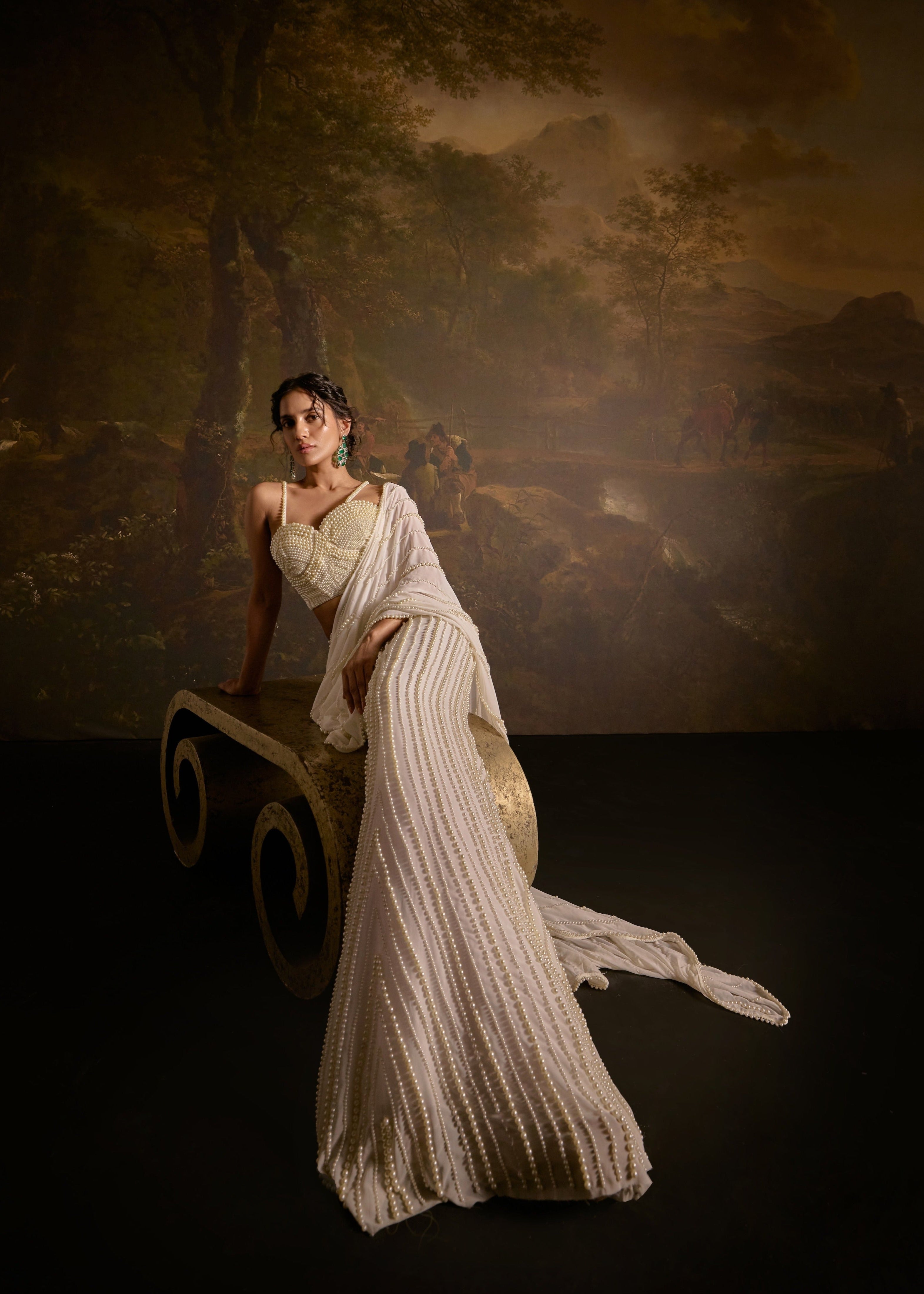 "Mahima White Pearl Embroidered Saree: White saree adorned with delicate pearl embroidery for an elegant and sophisticated look."