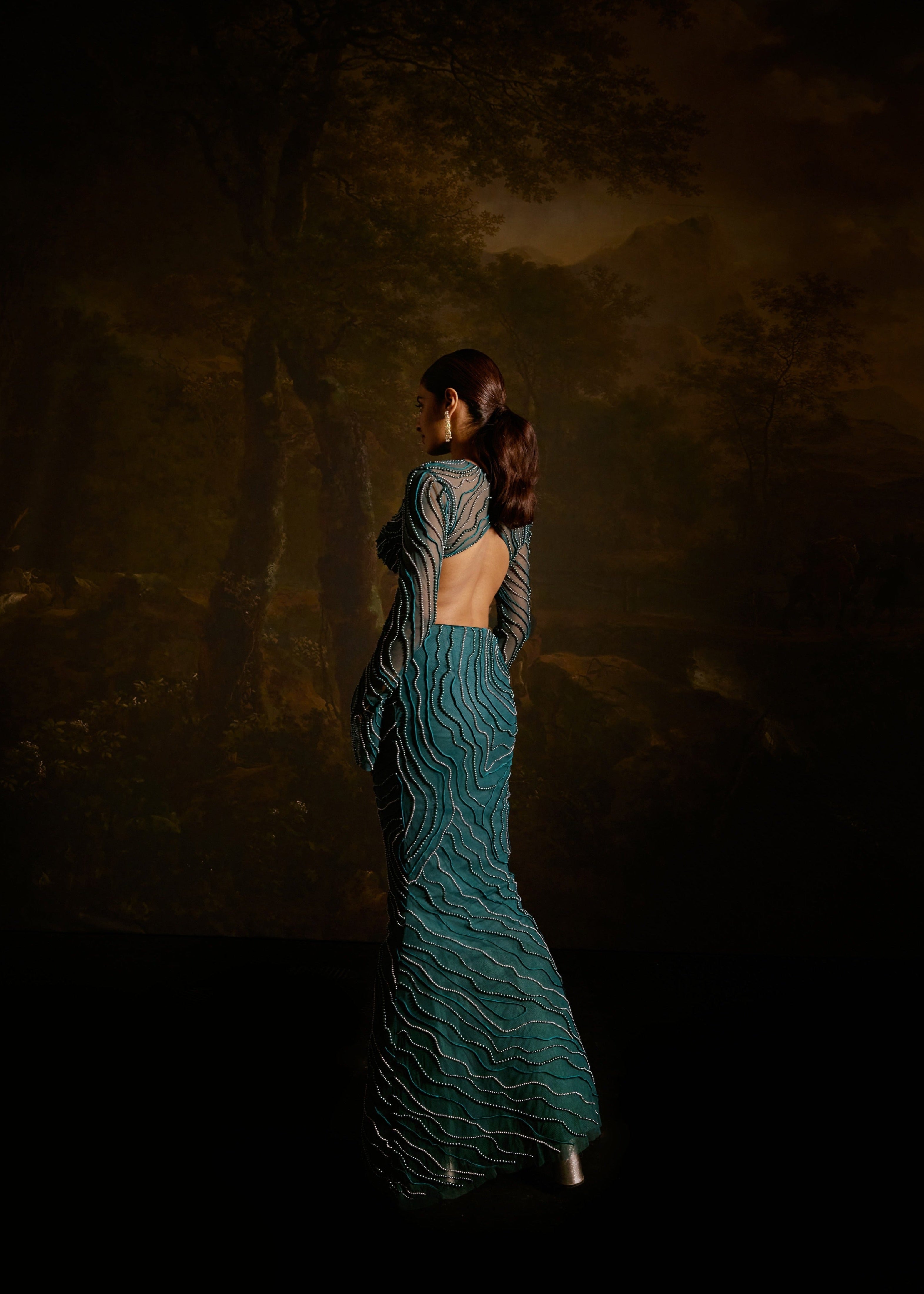 "Meera Teal Embroidered Lehenga Set: Teal lehenga set with intricate embroidery for a graceful and traditional appearance."