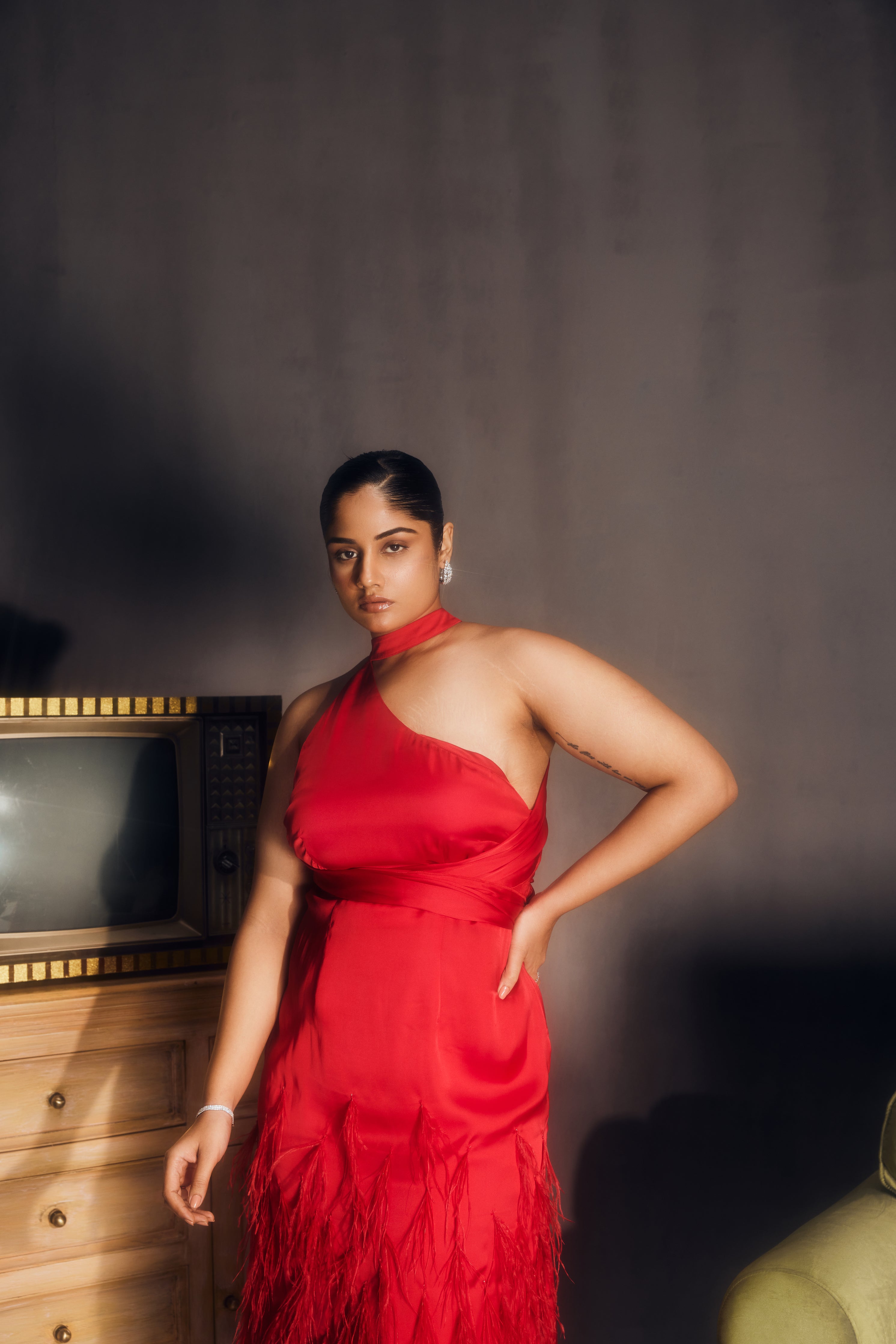 Michaela Red Satin Feather Midi Dress, combining luxurious satin fabric with dramatic feather accents for a striking look