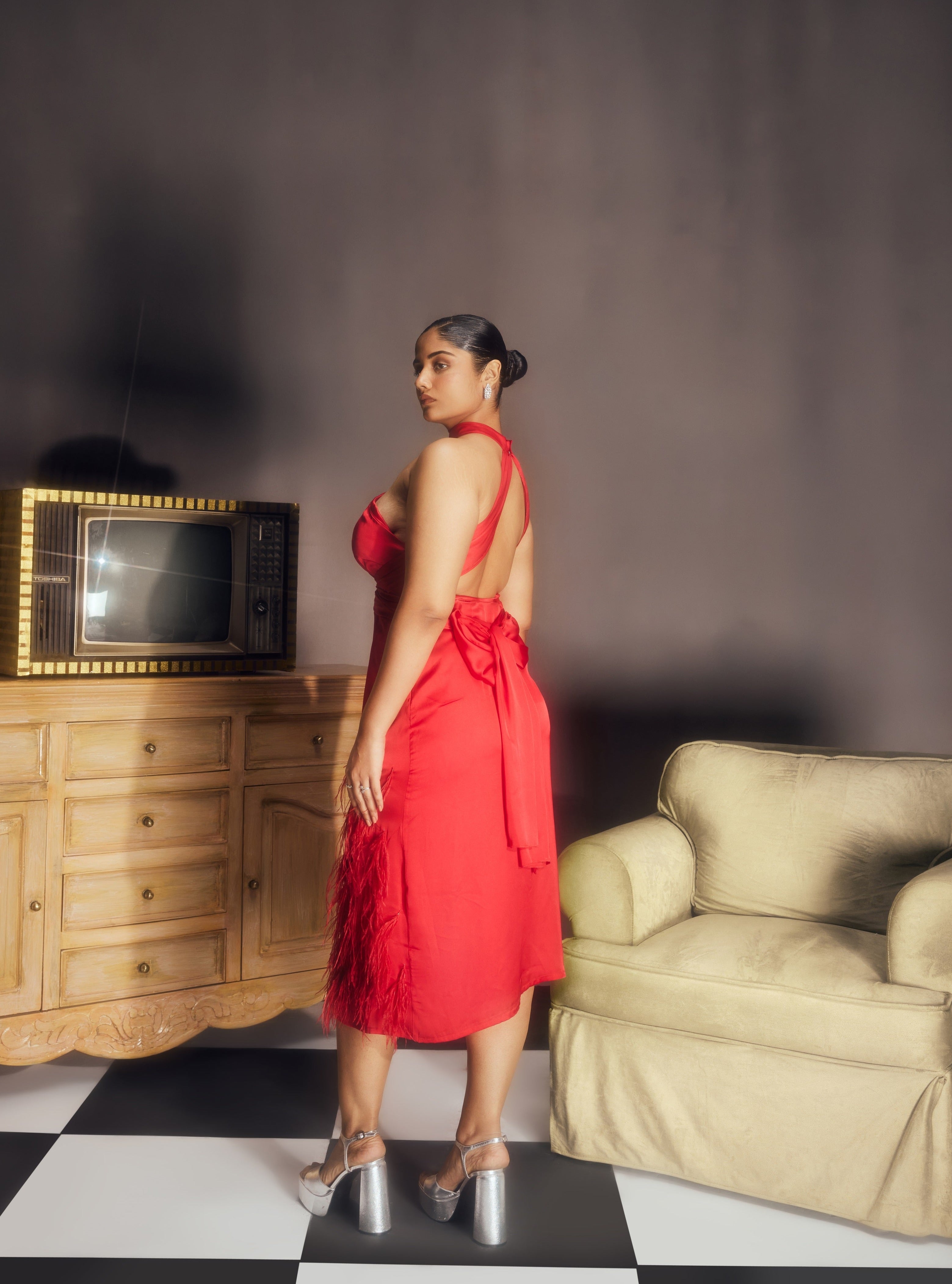 Michaela Red Satin Feather Midi Dress, combining luxurious satin fabric with dramatic feather accents for a striking look