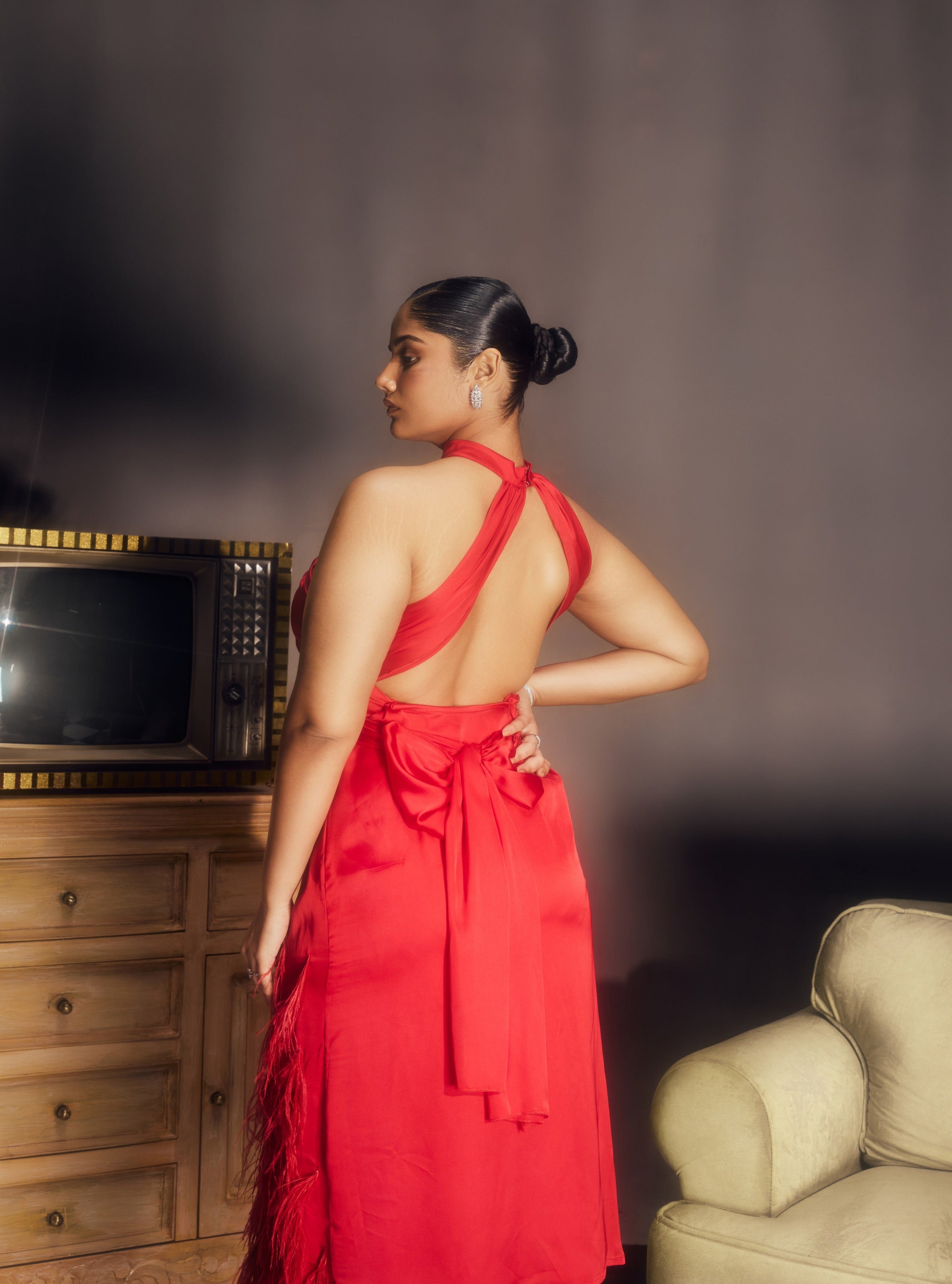 Michaela Red Satin Feather Midi Dress, combining luxurious satin fabric with dramatic feather accents for a striking look