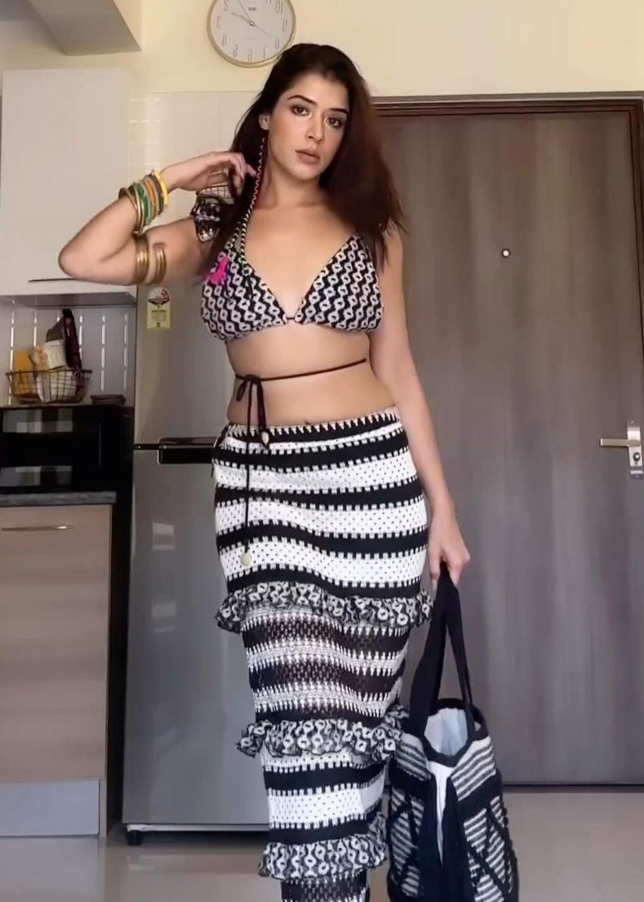 Mirari Black and White Crochet Cover-up Skirt featuring intricate crochet work and stylish black-and-white design