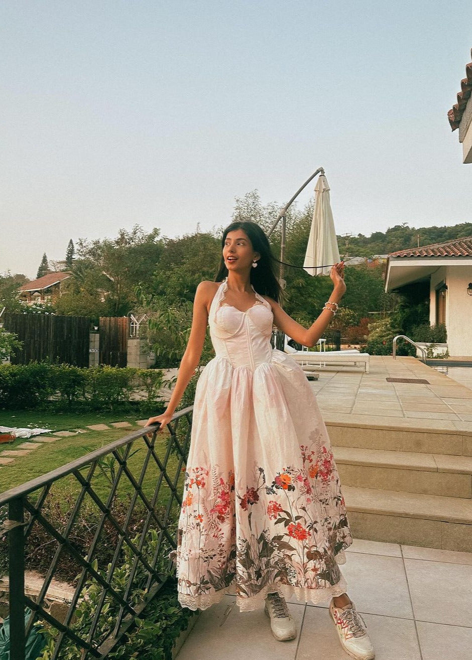 Oaklynn White Floral Corset Halter Midi Dress featuring a fitted bodice and flowy skirt adorned with delicate floral patterns