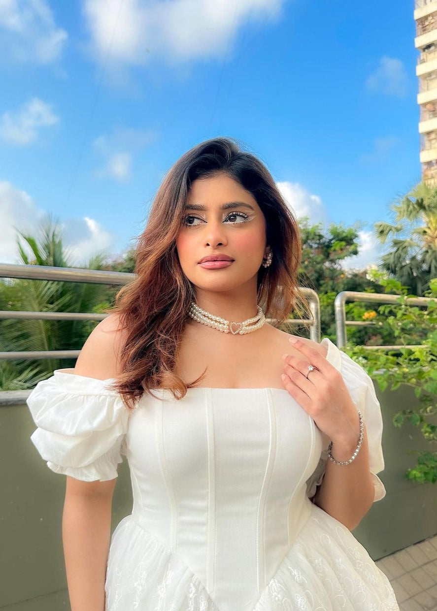 Ophelia White Embroidered Puff Mini Corset Dress featuring intricate embroidery and puff sleeves for a stylish look