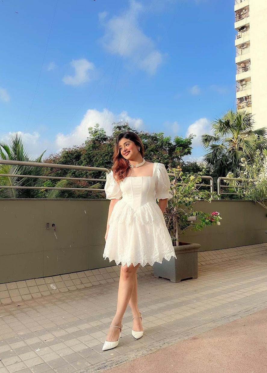 Ophelia White Embroidered Puff Mini Corset Dress featuring intricate embroidery and puff sleeves for a stylish look