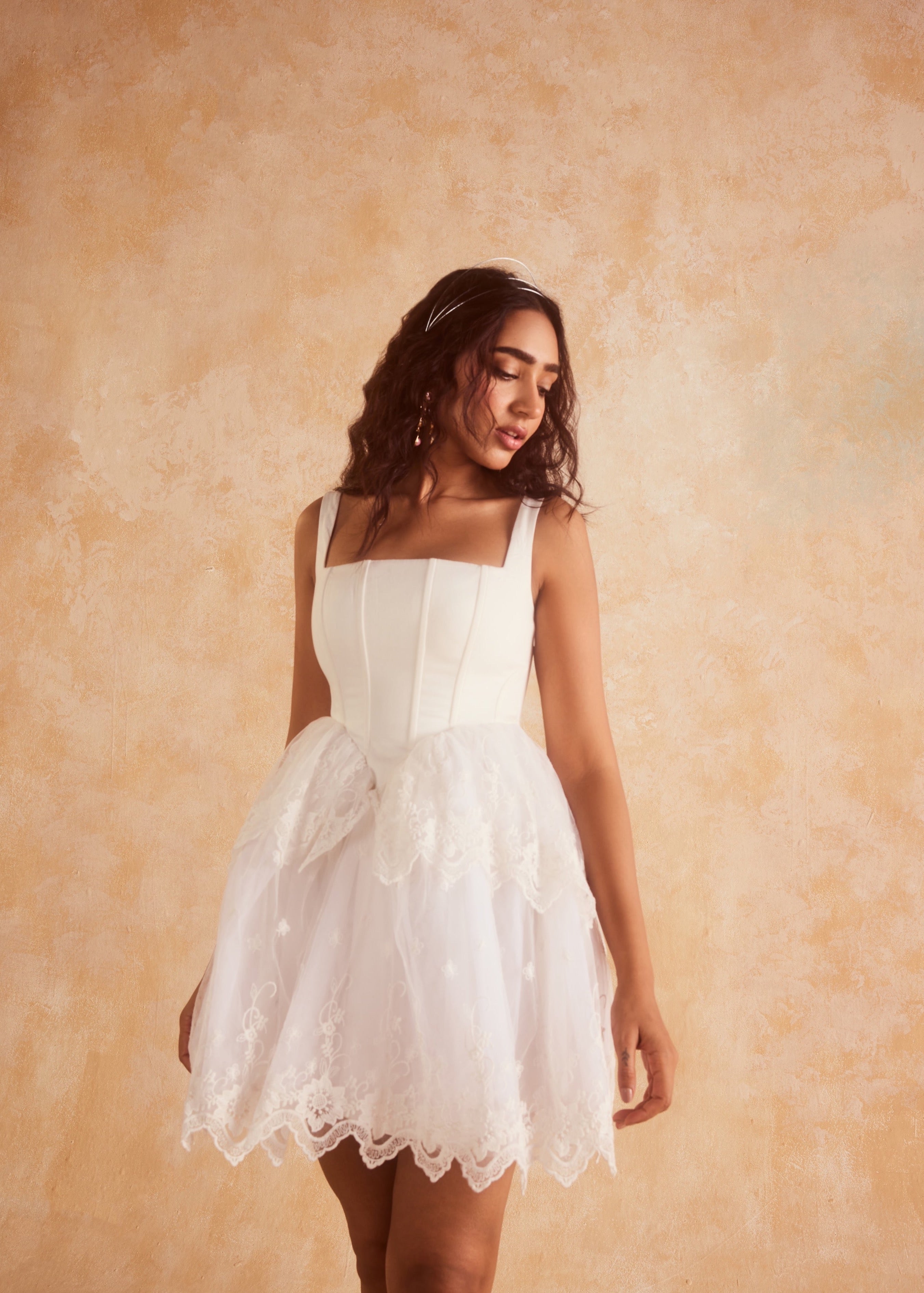 Ophelia White Embroidered Puff Mini Corset Dress with intricate embroidery and a puff silhouette in elegant white.