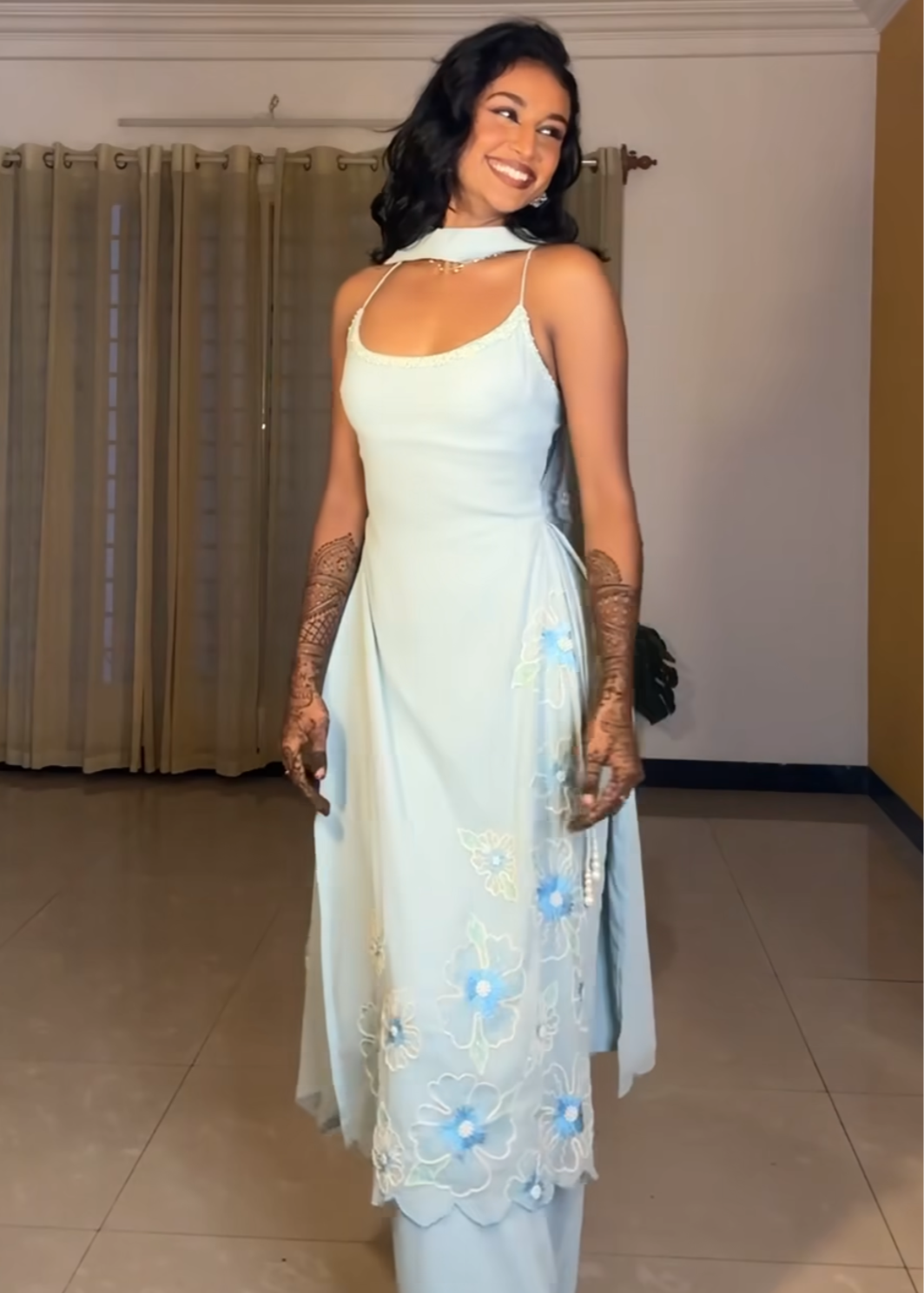 "Raaya Baby Blue Hand-Embroidered Sleeveless Suit: Delicate and charming baby blue suit with intricate hand embroidery and a sleeveless design."