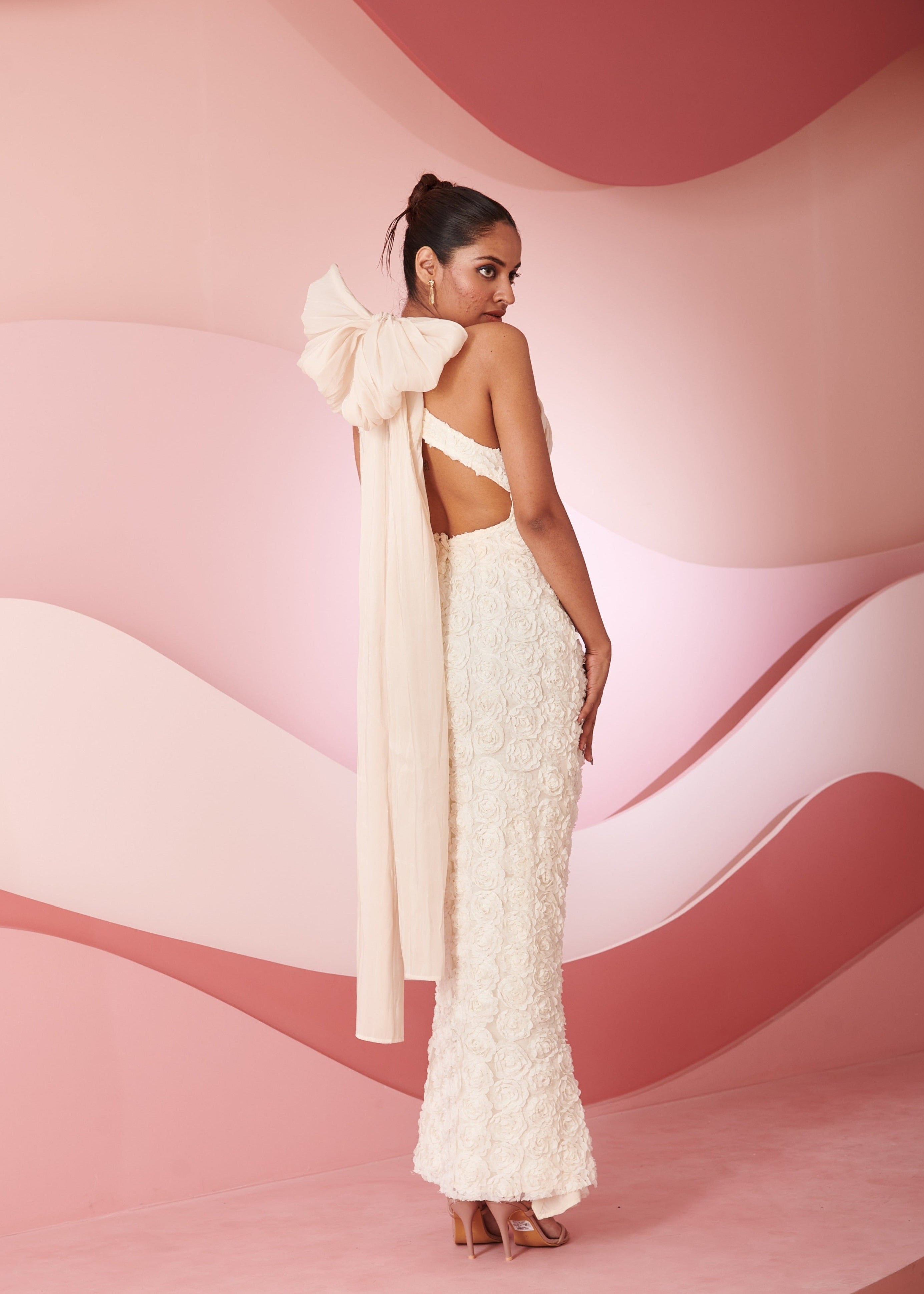 Rabia ivory 3D floral embroidered cutout gown featuring dimensional floral details and stylish cutouts, perfect for a striking and elegant look.