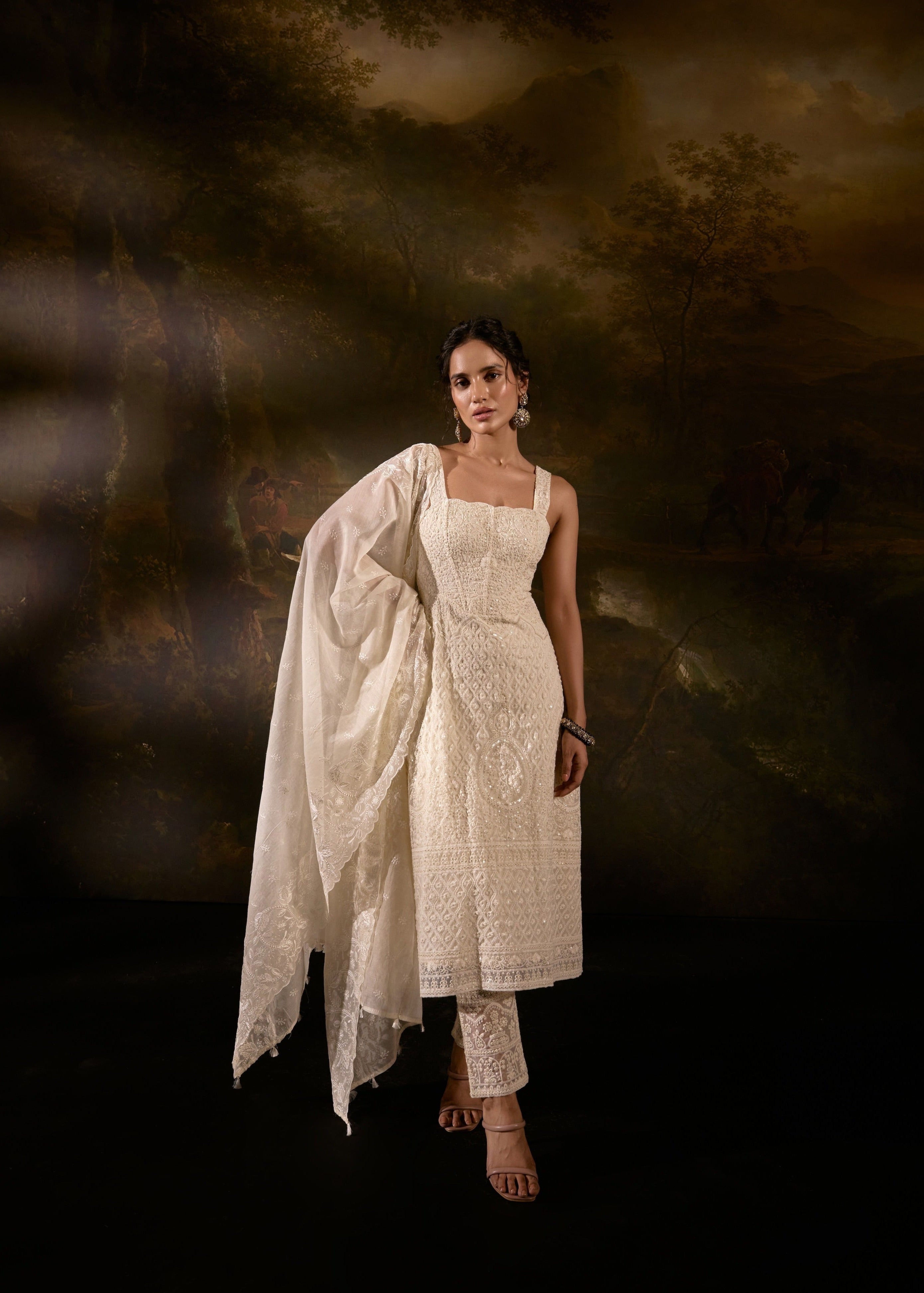 "Sajoon White Organza Chikankari Corset Anarkali Suit Set: Elegant Anarkali suit set in white organza with Chikankari embroidery and a corset design."