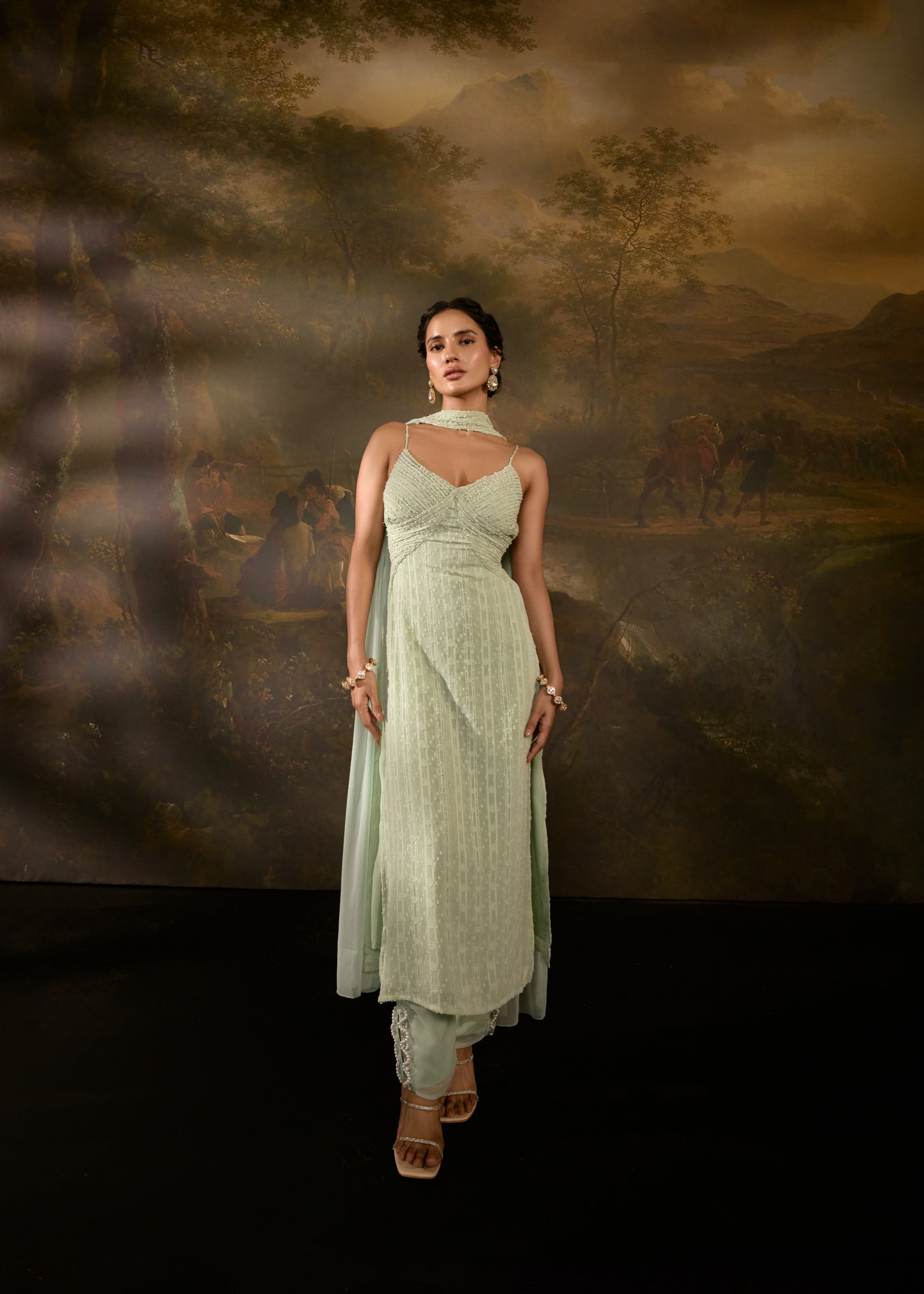 "Shimaz Sage Green Sleeveless Suit: Elegant sleeveless suit in sage green, offering a chic and modern look."